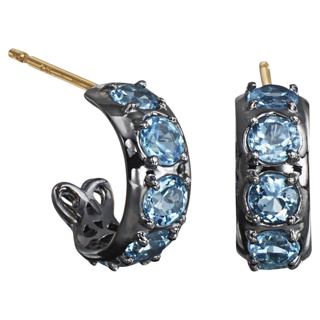 Sterling Silver Huggie Hoop Earrings with Blue Topaz For Sale