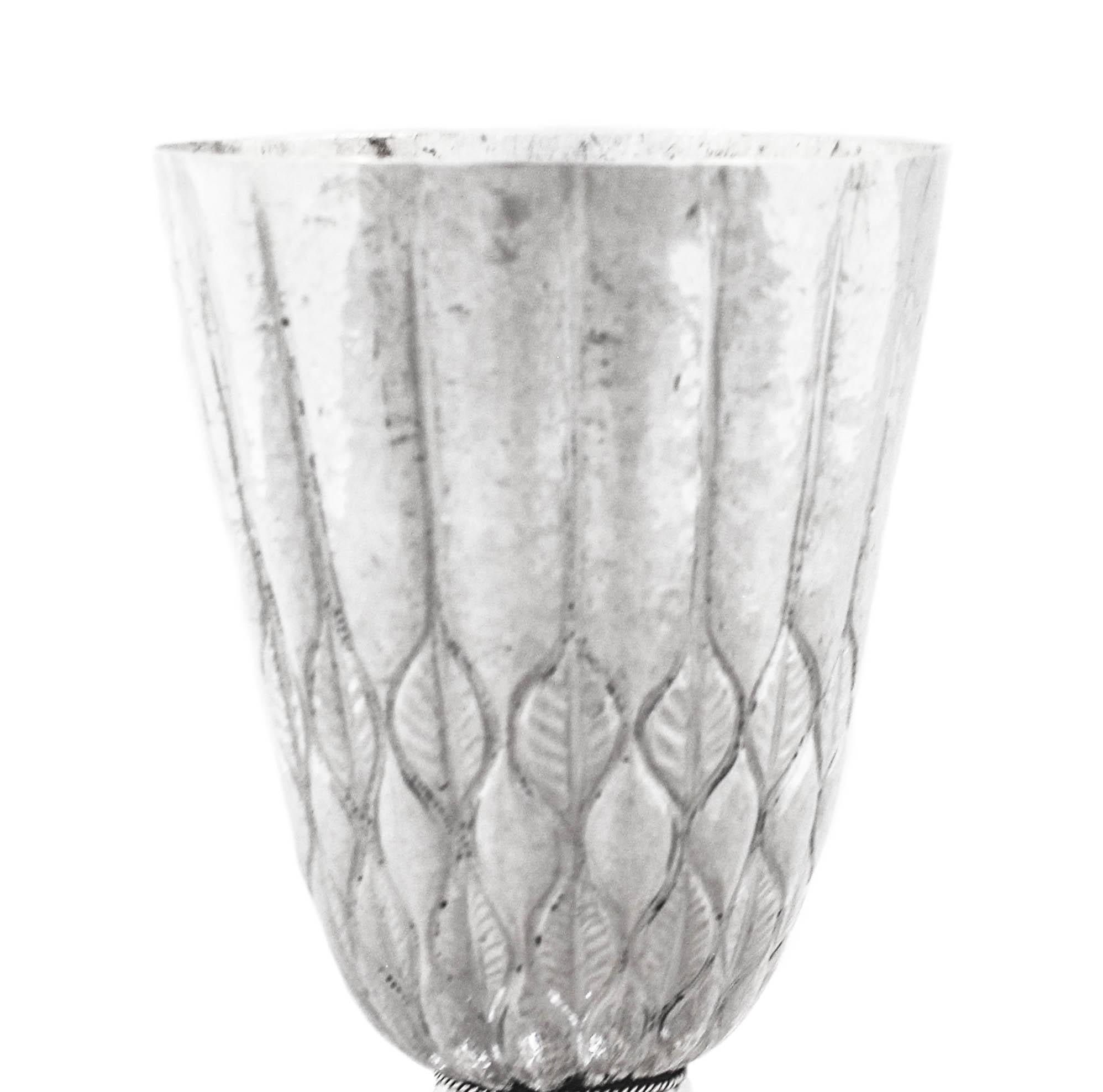Being offered is a spectacular sterling silver antique chalice made in Austria. It has hand-wrought and hammered.