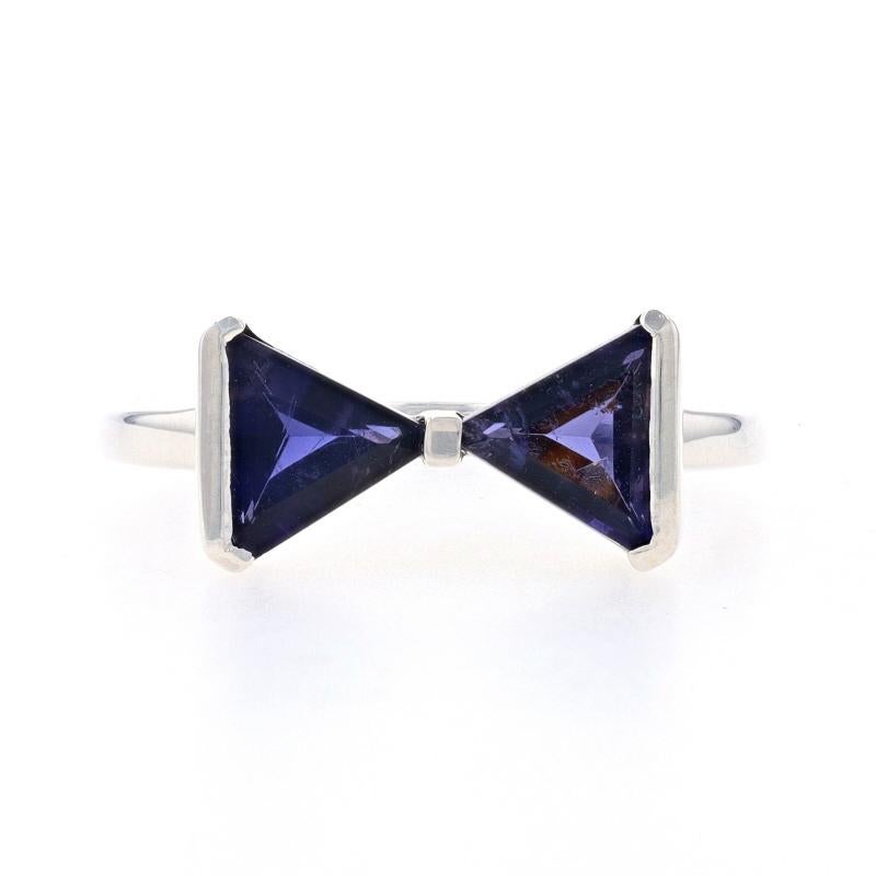 Size: 10 1/4

Metal Content: Sterling Silver

Stone Information
Natural Iolites
Carat(s): 1.35ctw
Cut: Triangle
Color: Purple

Total Carats: 1.35ctw

Style: Two-Stone
Theme: Bow Tie

Measurements
Face Height (north to south): 11/32