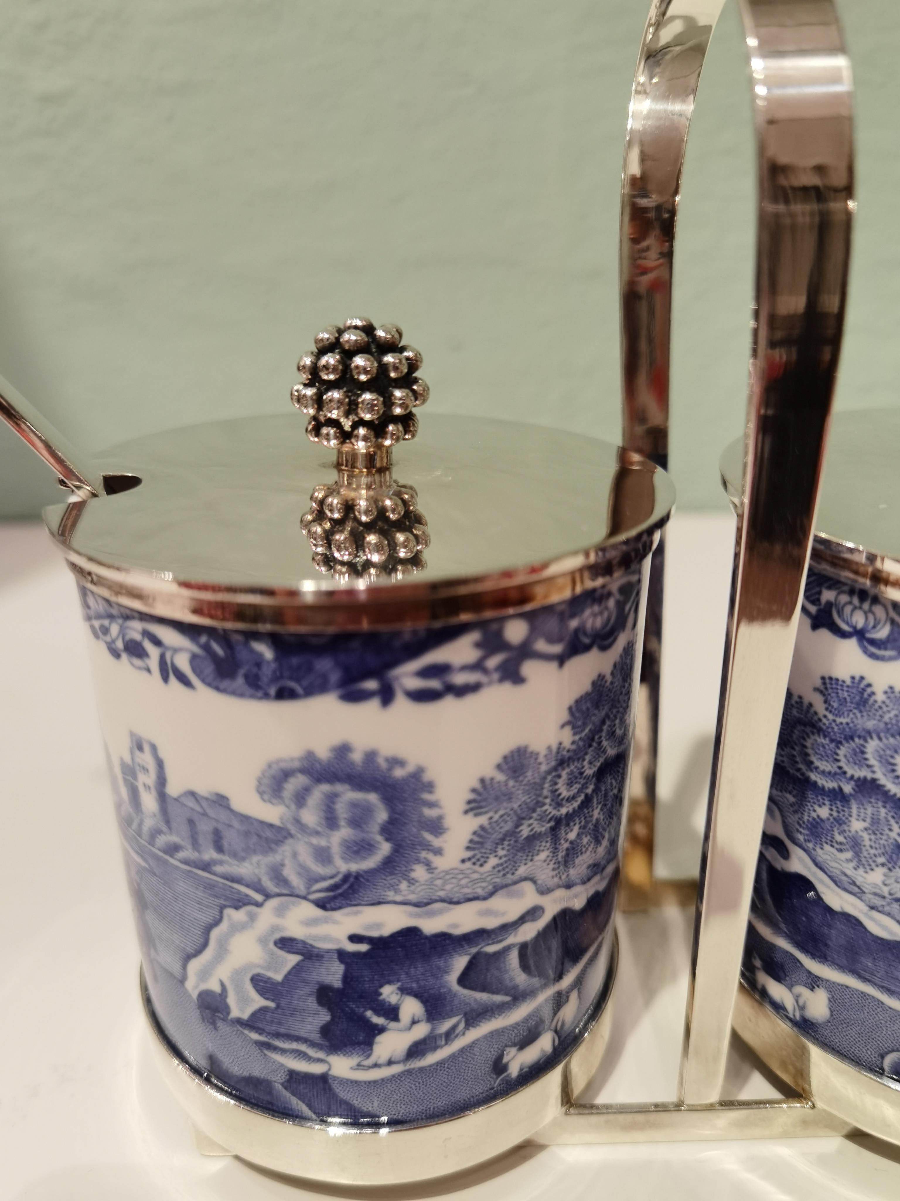 Jar of jam with two porcelain jars with Spode Italian blue decor. Lids and spoons stamped sterling silver with naturalistic berries on top. The jars stamped Bone China Copeland Spode Italian England. Silver stand produced by Gebrüder Deyhle/