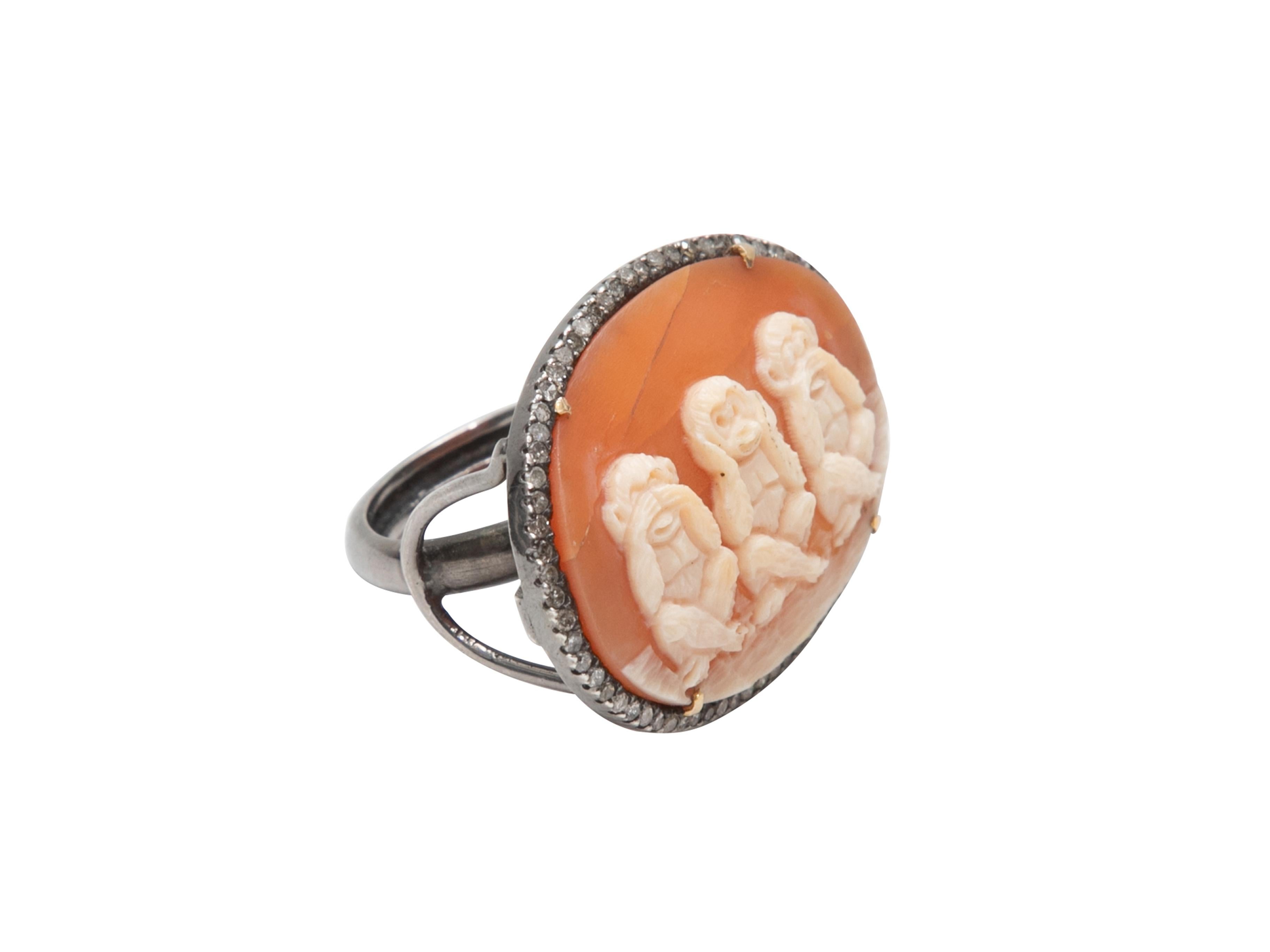Product Details: Sterling silver and carved shell monkey cameo cocktail ring by Jennifer Miller. Pave diamonds at border. 1.5