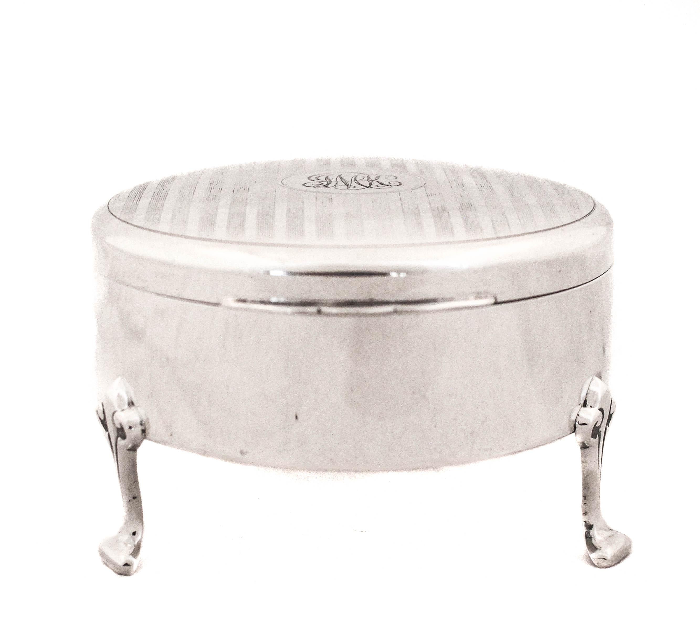A lovely sterling silver jewelry box is yours for the taking.  Designed and manufactured by Henry Birks & Sons of Montreal Canada.  It has some unique features; the round shape rather than square or rectangular, it stands on four feet rather than