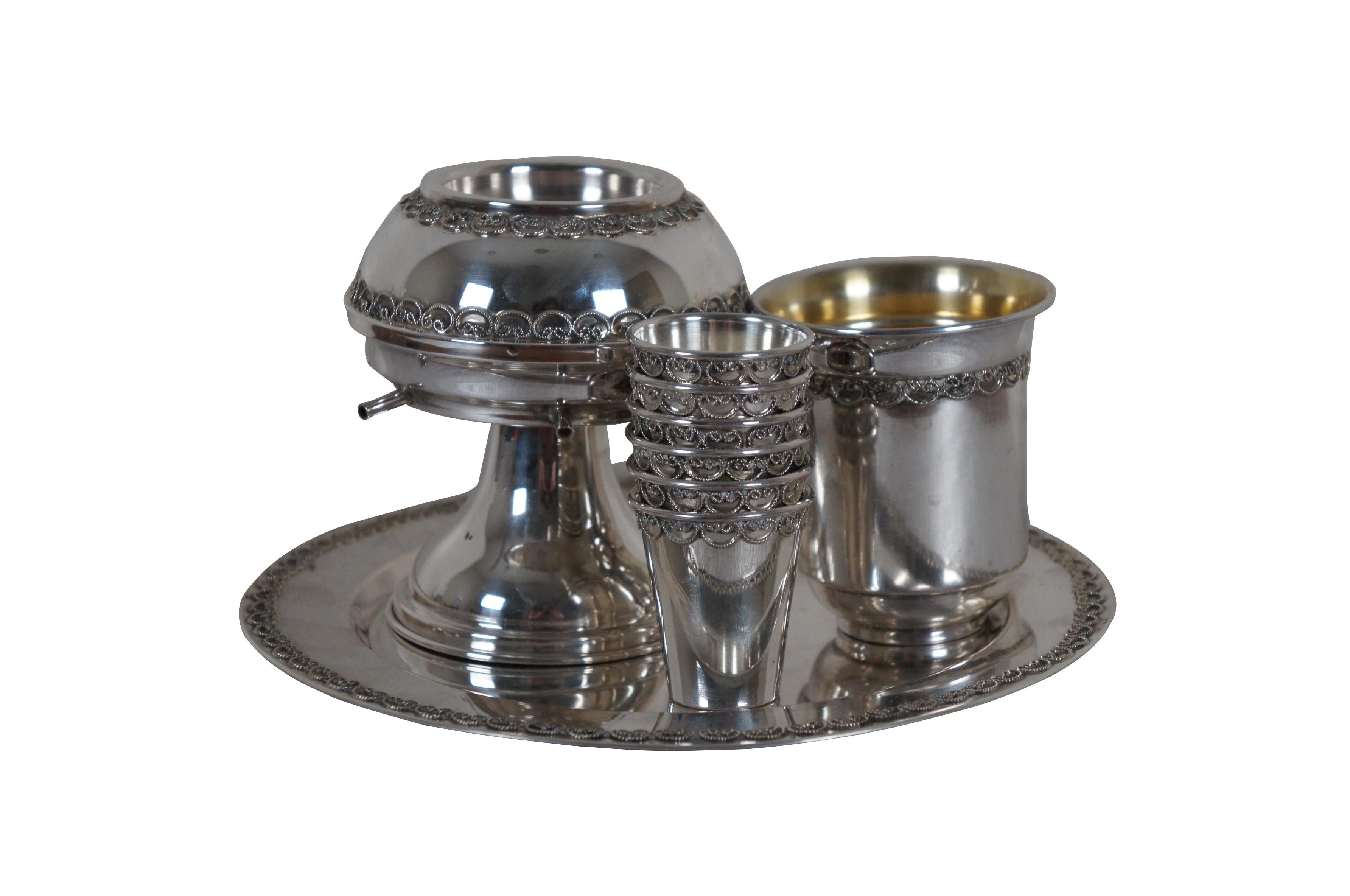 Vintage 925 sterling silver kiddush wine fountain set, decorated with bands of repeated filigree swirls. Set includes six cups, underplate, fountain and wine cup. 

Dimensions:
Plate & Wine Fountain - 8.25