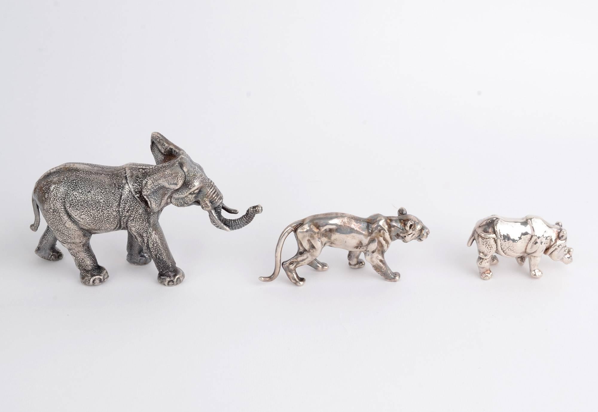 Five sterling silver jungle animals to include: an elephant; a lion; a rhinoceros; a jungle cat and a wading bird with a fish in its mouth.  The pieces are marked sterling and all except the bird have maker's marks, although they are