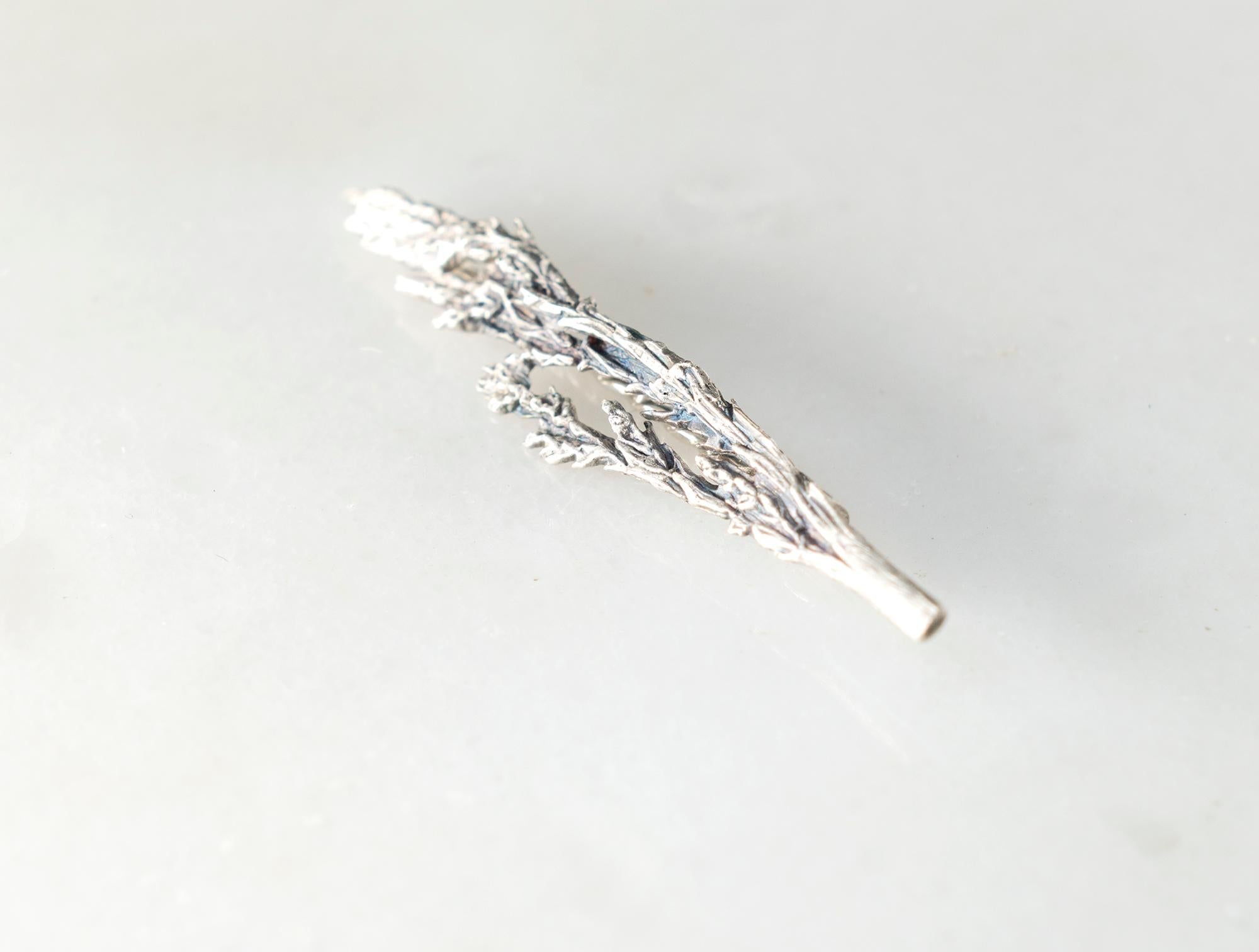 This Winter Garden Juniper contemporary Sculptural brooch is meticulously crafted from sterling silver. It represents a new and coveted it-piece for those seeking something truly special and unique. Notably, it has been featured in Vogue UA and