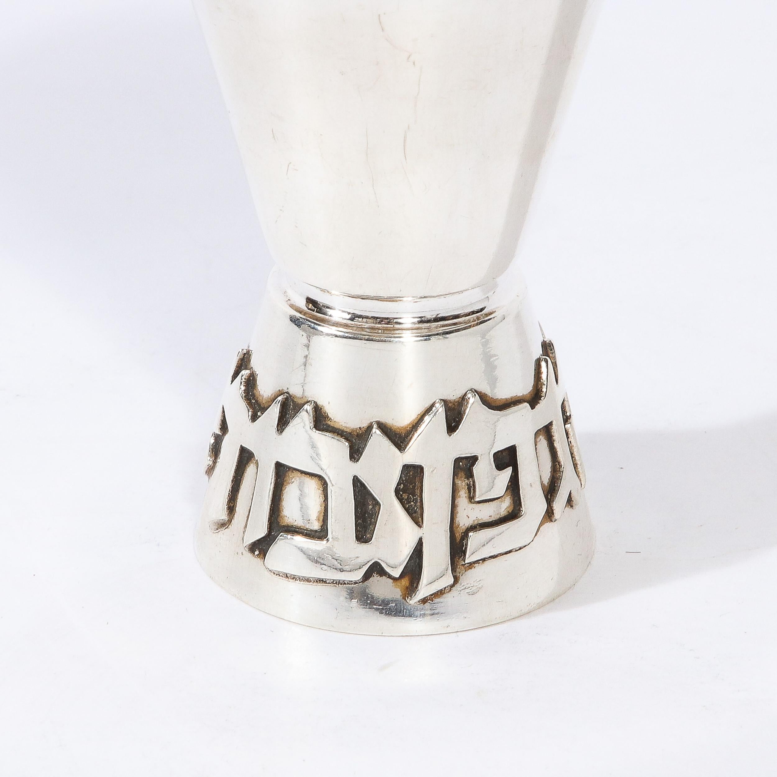 This charming Sterling Silver Kiddish Cup with Hebrew Lettered Base is by Ludwig Holpert and originates from the United States, Circa 1970. Featuring a tapered form and beautifully scaled proportions, the base is inscribed with a Hebrew blessing