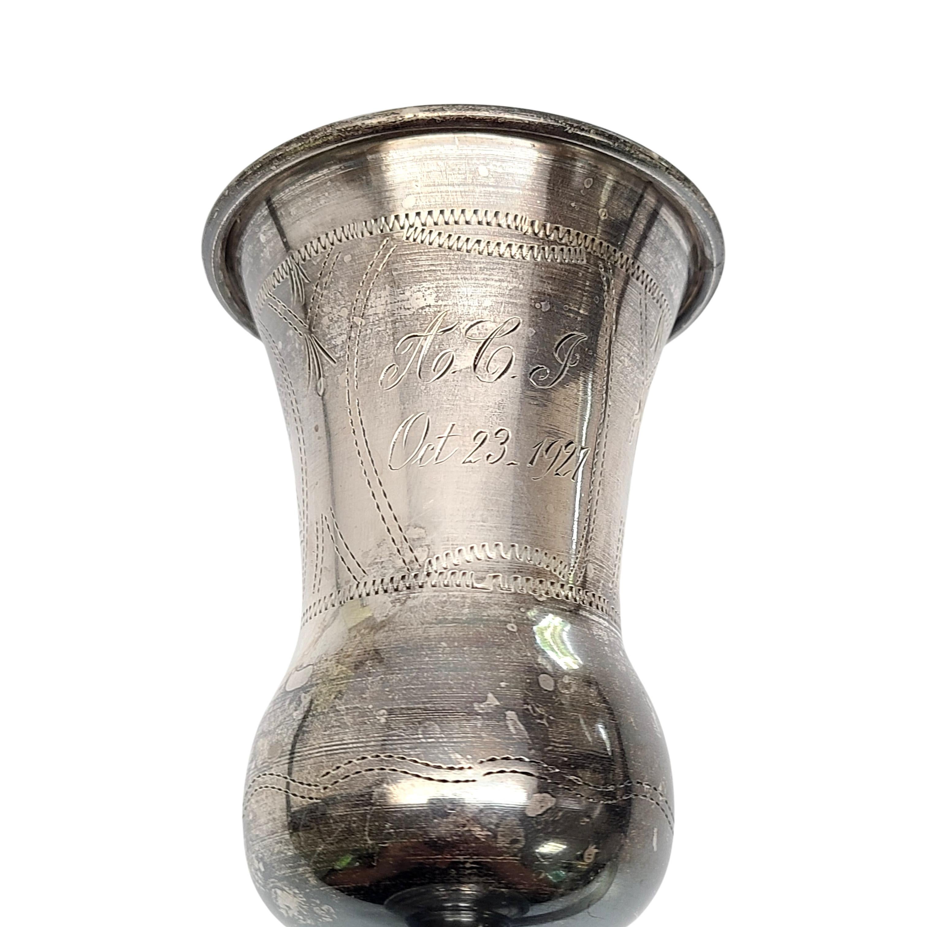 Sterling silver kiddush cup.

Large goblet with beautiful bright cut etched design around the cup. Engraving appears to be M.Y. and A.C.J. Oct 23, 1927 

Measures 6 3/4