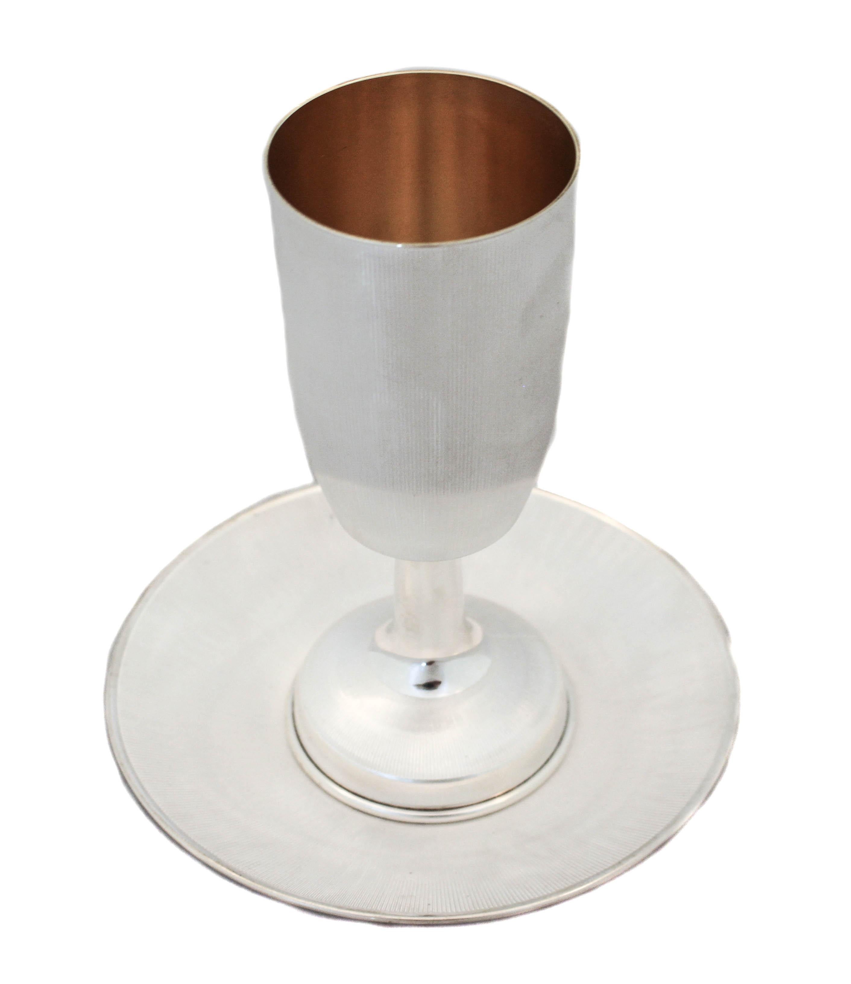 We are just gaga over this sterling silver Kiddush cup and plate. It has a matt finish and very thin ridges around the goblet and base, as well as the plate. Very handsome and masculine, it’s sure to dress up your table!