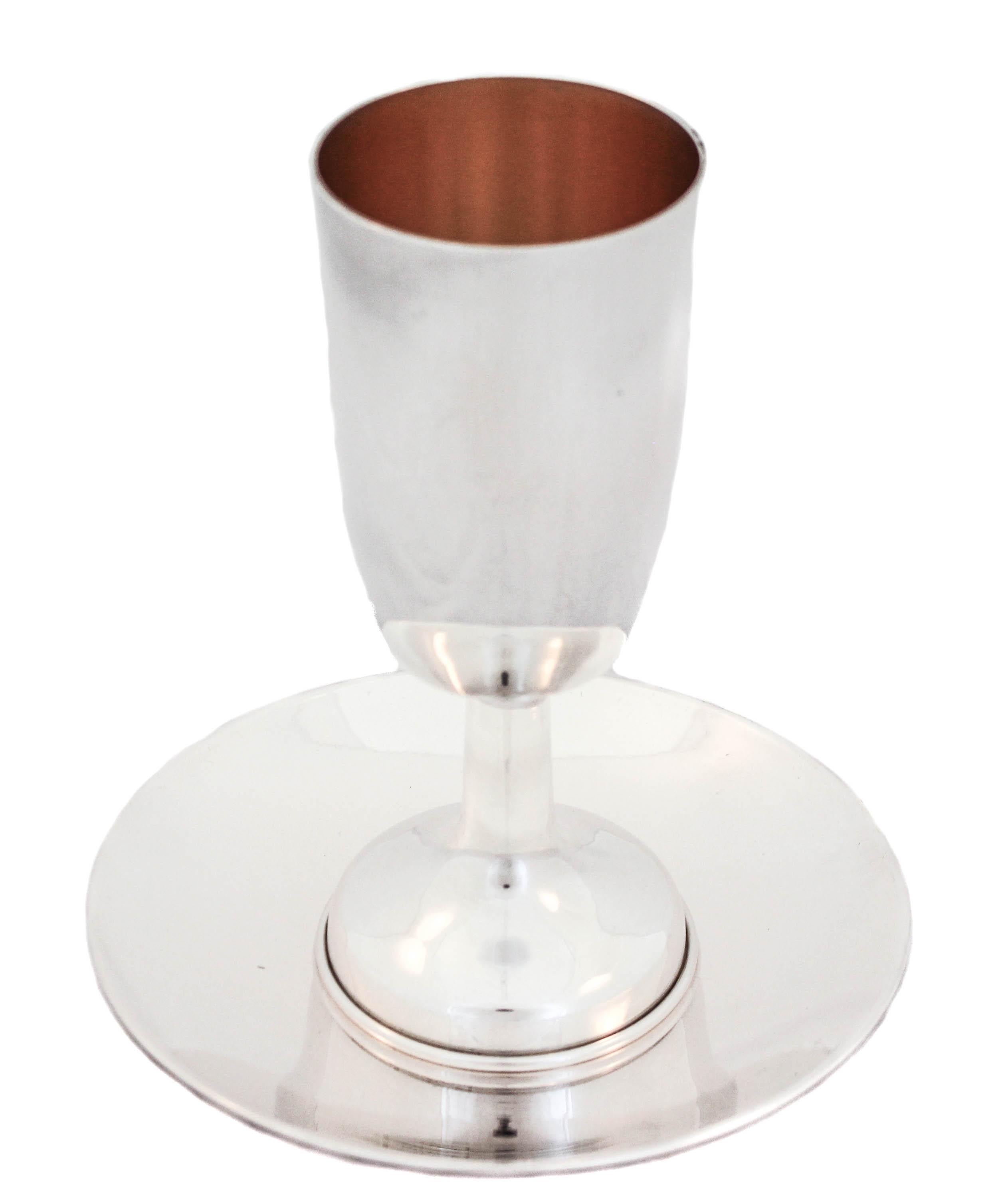 A sterling silver Kiddush cup (goblet) and plate, manufactured in Israel. Uber modern and sleek this set is beautiful for a groom or newlywed couple. It’s new but has a Mid-Century look.