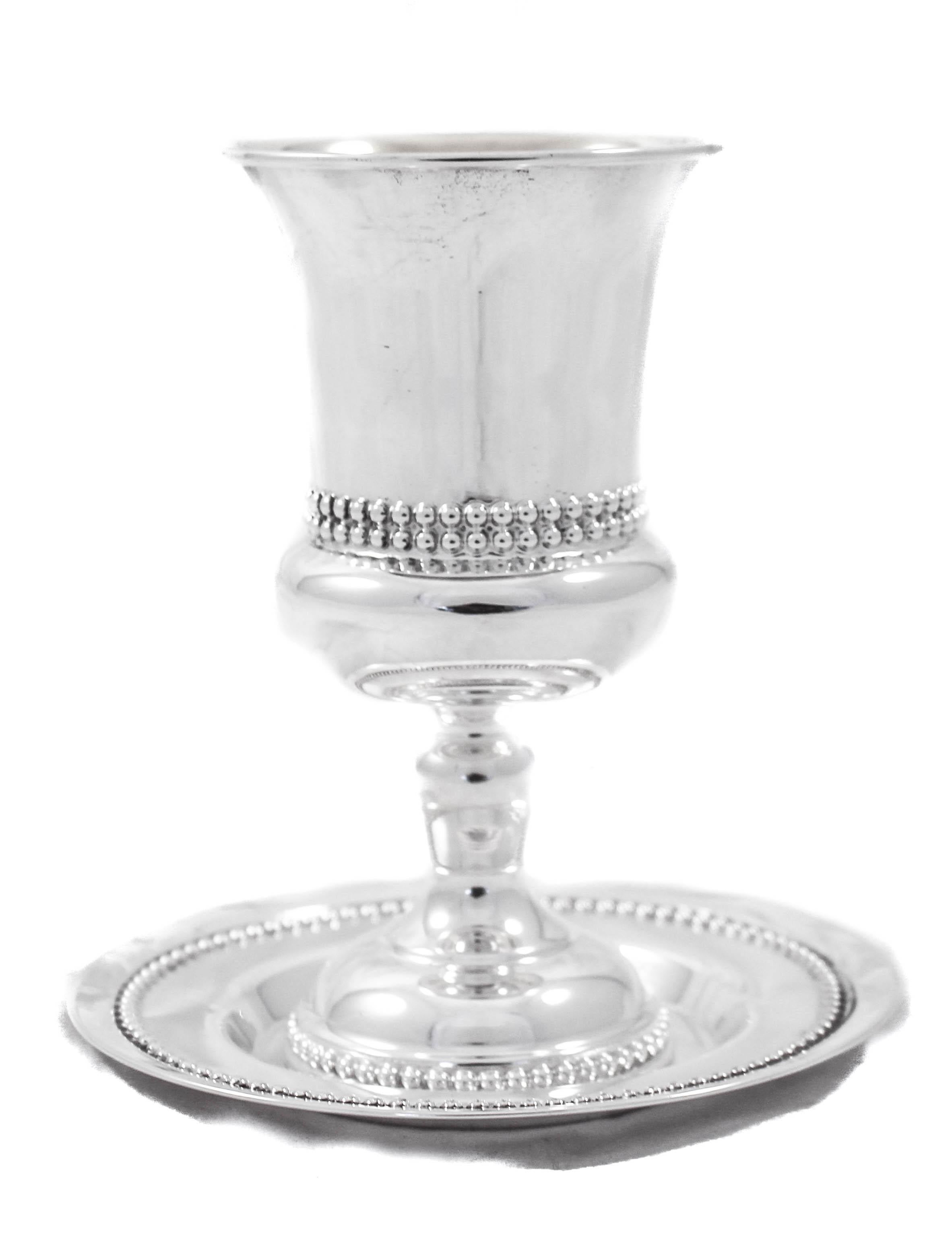We are happy to offer this sterling silver Kiddush goblet and matching plate, made in Israel. The goblet has a Classic shape with beading around the center and base while the plate has beading along the edge. A lovely wedding or even a bar mitzvah