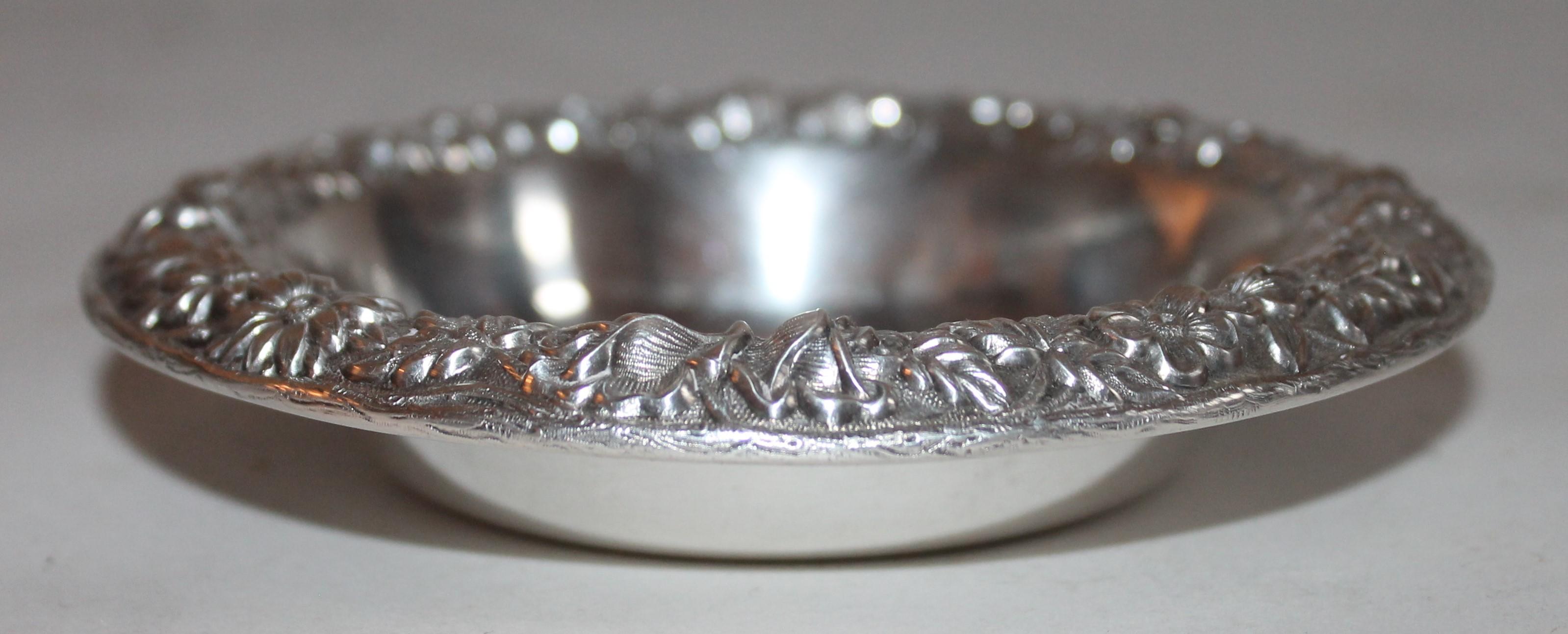 This sterling silver bon bon bowl is signed sterling & S. Kirk & Sons Inc. This is a heavy bowl and looks like a finger bowl or candy dish. Very well made and full of detail work. This small bowl is a rare find.
