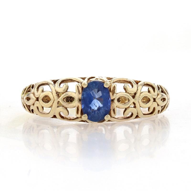Size: 8 1/4

Metal Content: Sterling Silver (gold plated)

Stone Information

Natural Kyanite
Cut: Oval
Color: Blue

Style: Solitaire
Features: Open Cut Botanical Scrollwork

Measurements

Face Height (north to south): 9/32