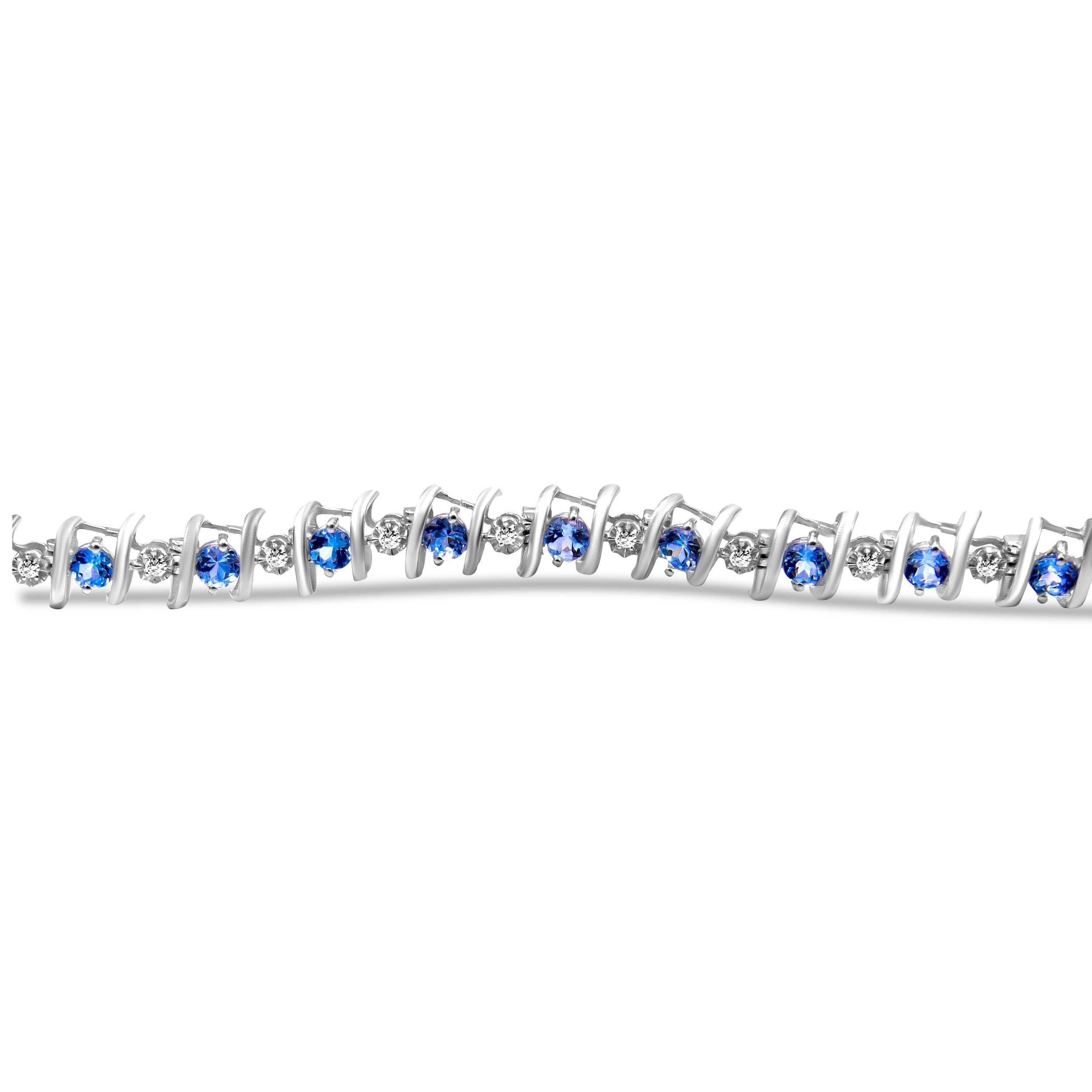 Vivid created birthstones and sparkling white diamonds are set in this S-link tennis bracelet crafted in cool .925 sterling silver. The bracelet features 20 sparkling diamonds set in miracle-plate settings that multiply their sparkle, for a total