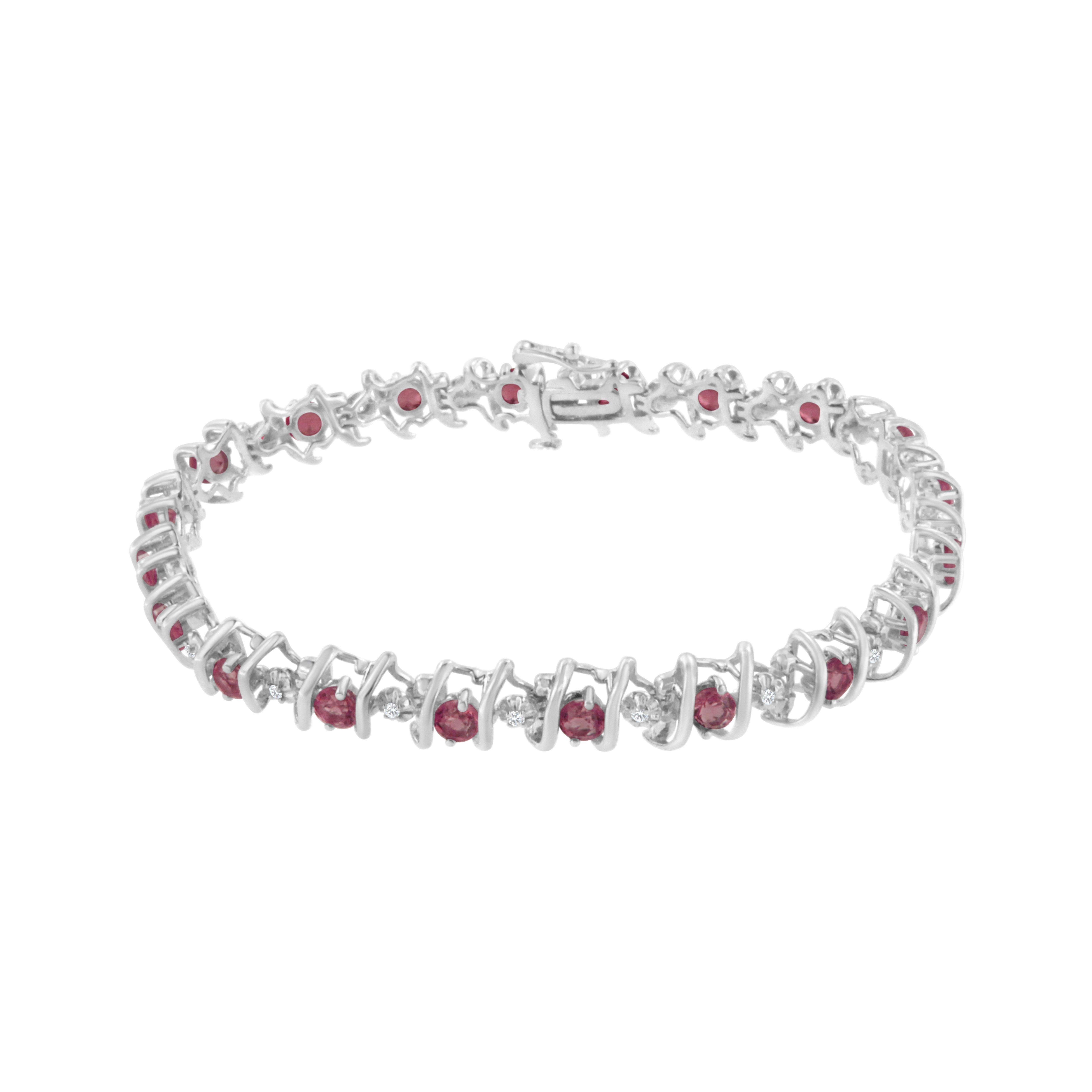 Vivid created birthstones and sparkling white diamonds are set in this S-link tennis bracelet crafted in cool .925 sterling silver. The bracelet features 20 sparkling diamonds set in miracle-plate settings that multiply their sparkle, for a total