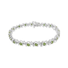 Sterling Silver Lab-Grown Gemstone and 1/6 Carat Round Diamond Tennis Bracelet