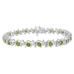 Sterling Silver Lab-Grown Gemstone and 1/6 Carat Round Diamond Tennis Bracelet