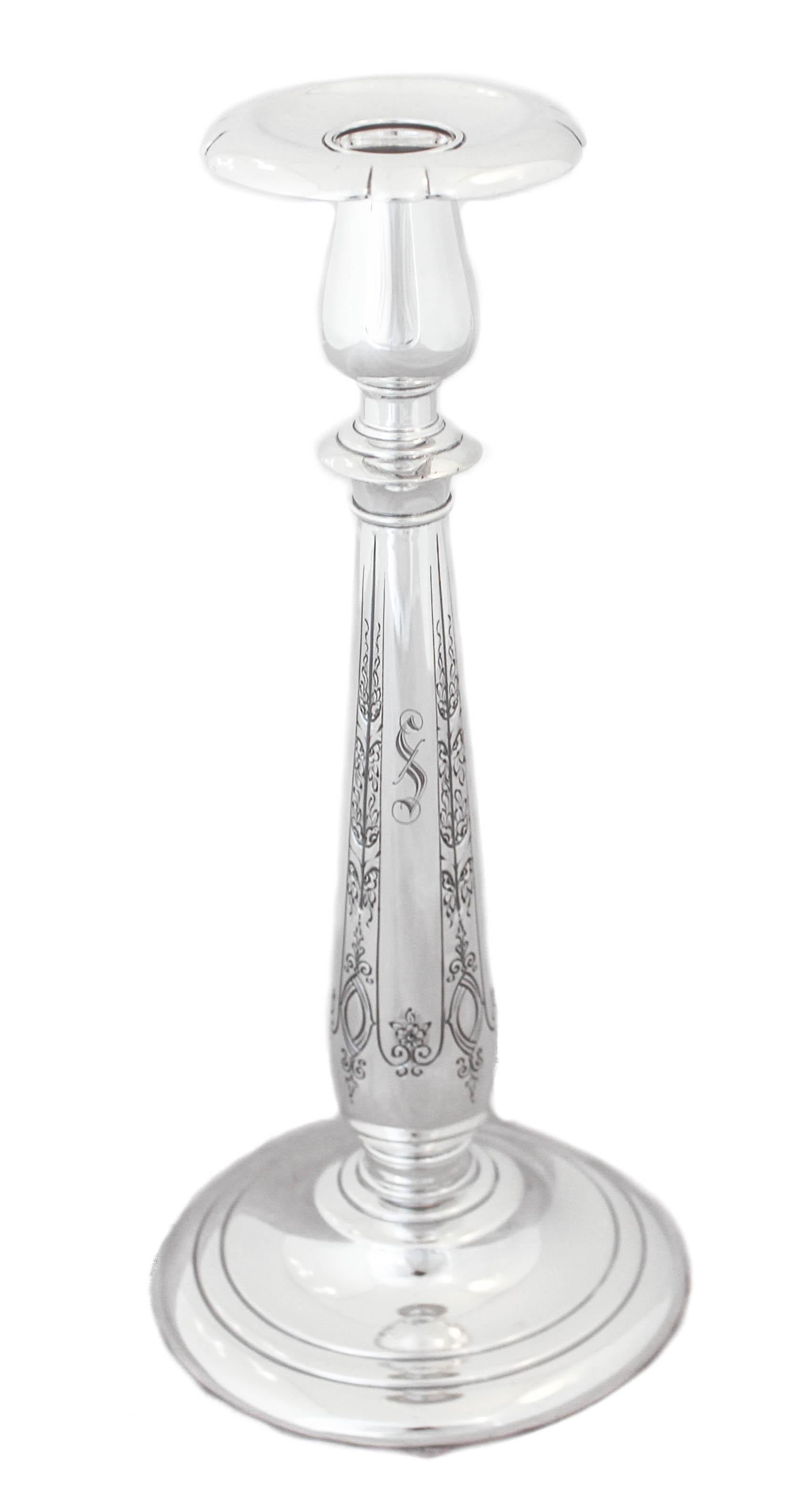 We are happy to offer you this pair of sterling silver candlesticks by Towle Silversmiths in the “Lady Diana” pattern, circa 1928. The have an Art Deco feel to them with the scalloped bobeche and shape. Very graceful and feminine they have an etched