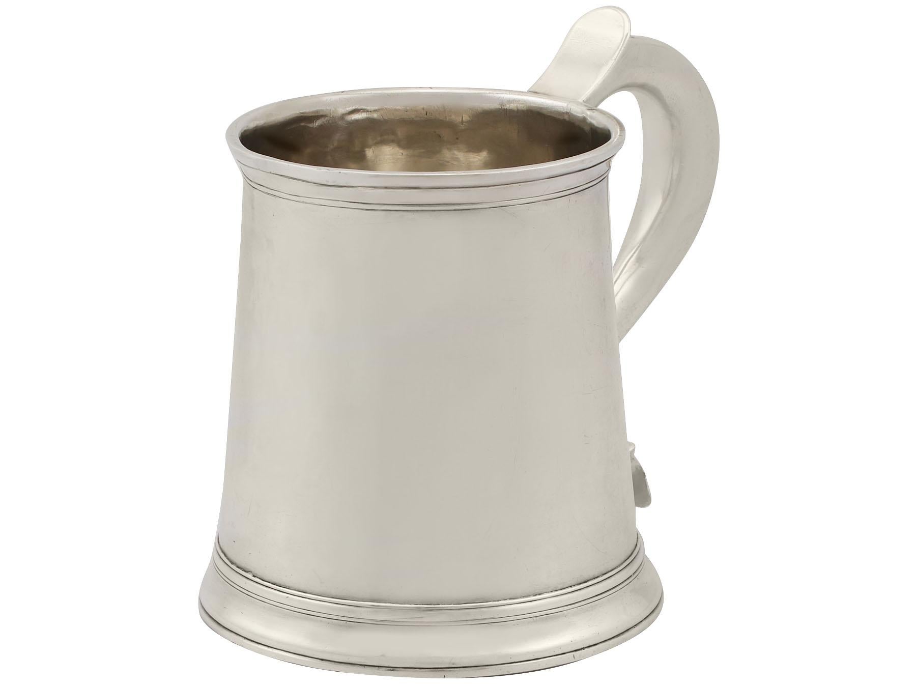 An exceptional, fine and impressive antique Georgian English sterling silver lady's mug, an addition to our wine and drink related silverware collection.

This exceptional antique George II sterling silver mug has a plain tapering cylindrical