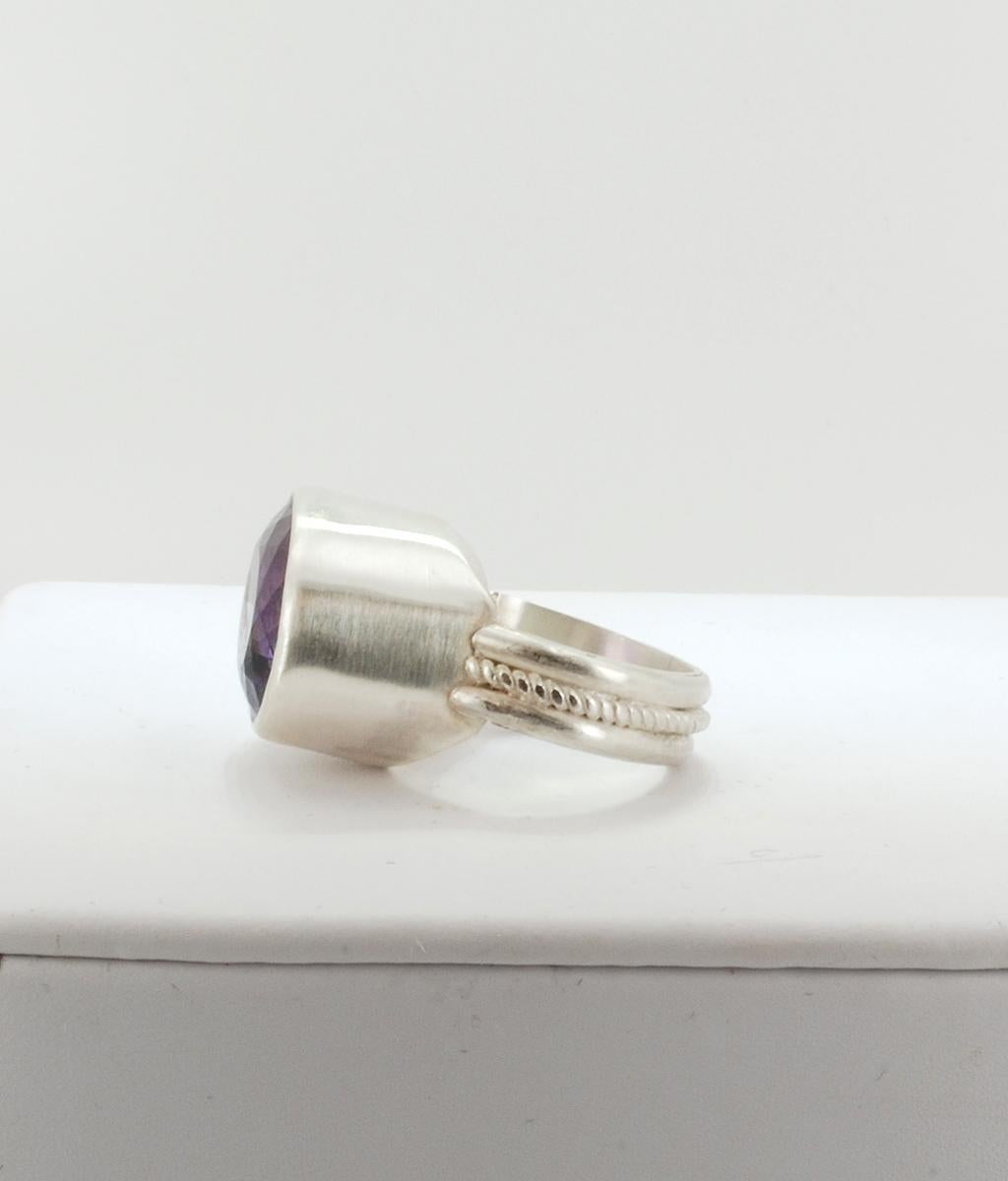 This ring is one-of-a-kind with a large oval deep purple 13.59 carat amethyst (1/2