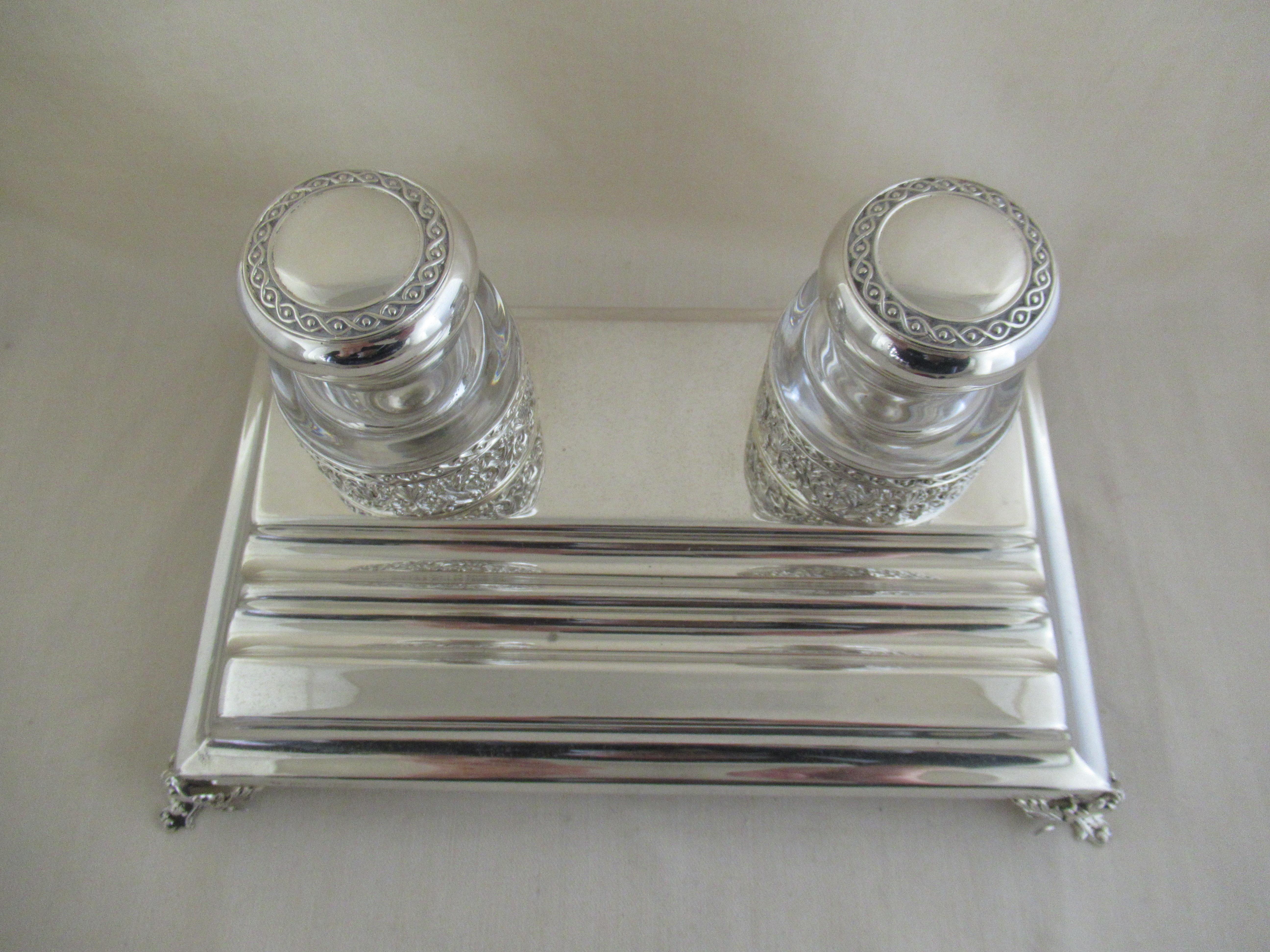 Antique Solid Silver DESK INK STAND
Made in Portugal, circa 1920 by TOPAZIO and marked with the sterling silver quality mark - 0,925, also with the Topazio trade mark - a shield with F M over T

A superb, rectangular pen stand with two pen