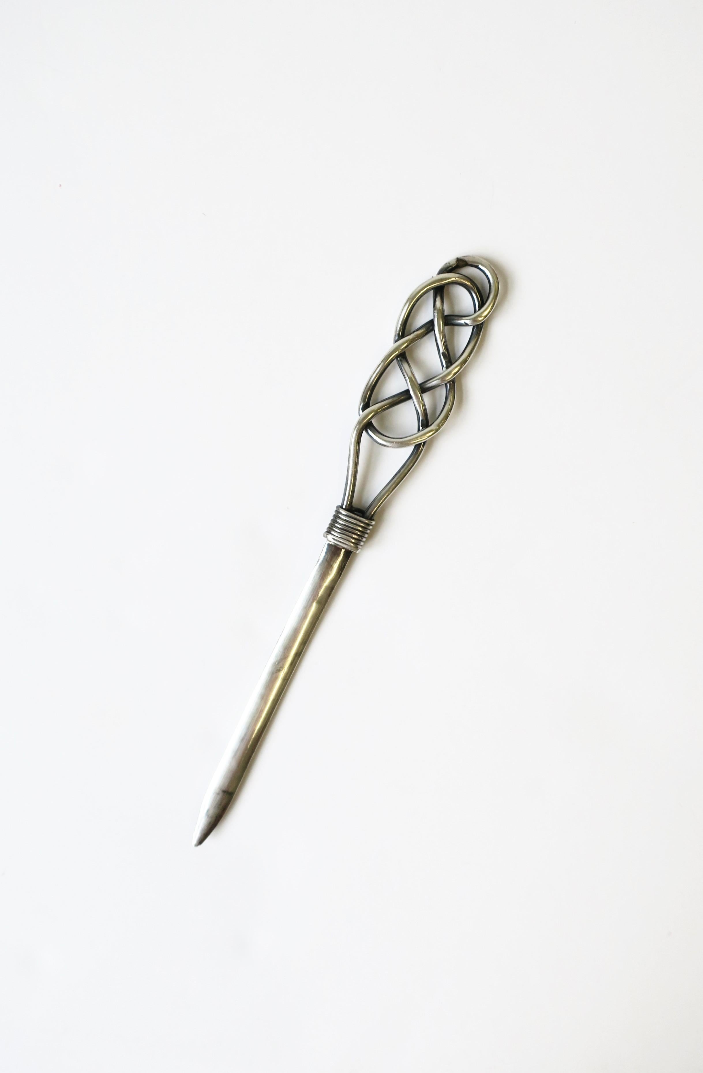 A beautiful sterling silver letter opener with braided handle, in the style of Hermes, circa mid-20th century, Mexico. This Mexican sterling silver letter opener with marking's: 