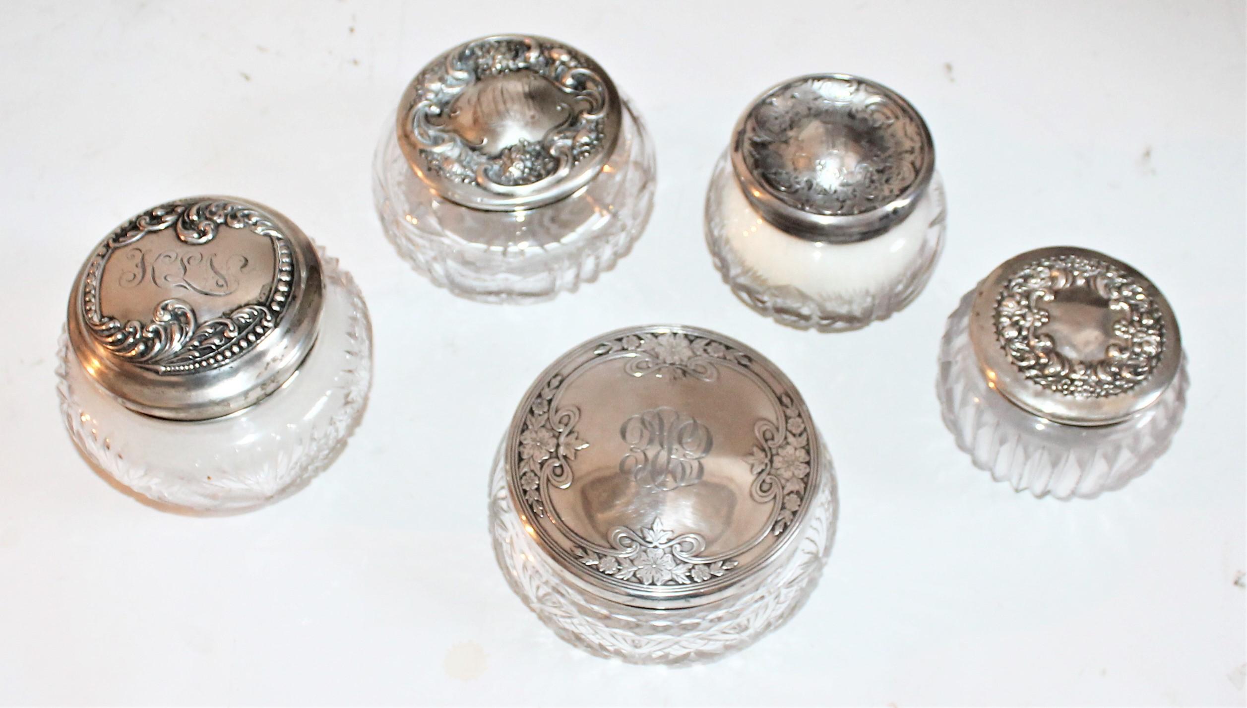 Measurements are as follows from left to right and center piece being last in measurements. Sterling silver lided cut glass jars.
4.5 x 4 , 3.5 x 3 , 3.5 x 2.75 , 4.5 x 3 , 5 x 2.3
   