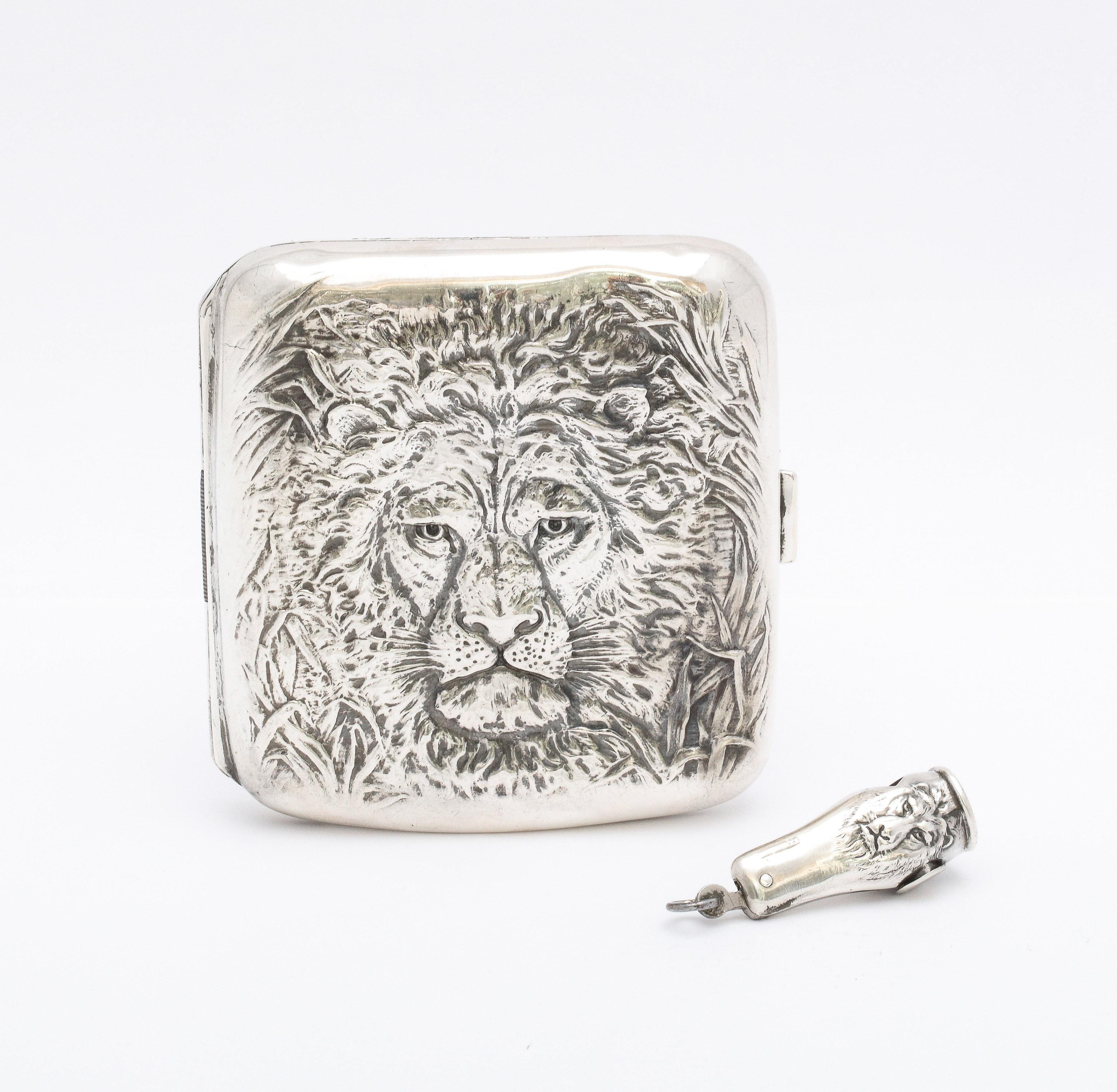 Fabulous, rare Art Nouveau Period, sterling silver lion's head motif cigarette case and matching working cutter, American, Ca. 1910. Both the cigarette case and matching cutter are designed with a full lion's head and mane. Inside of cigarette case
