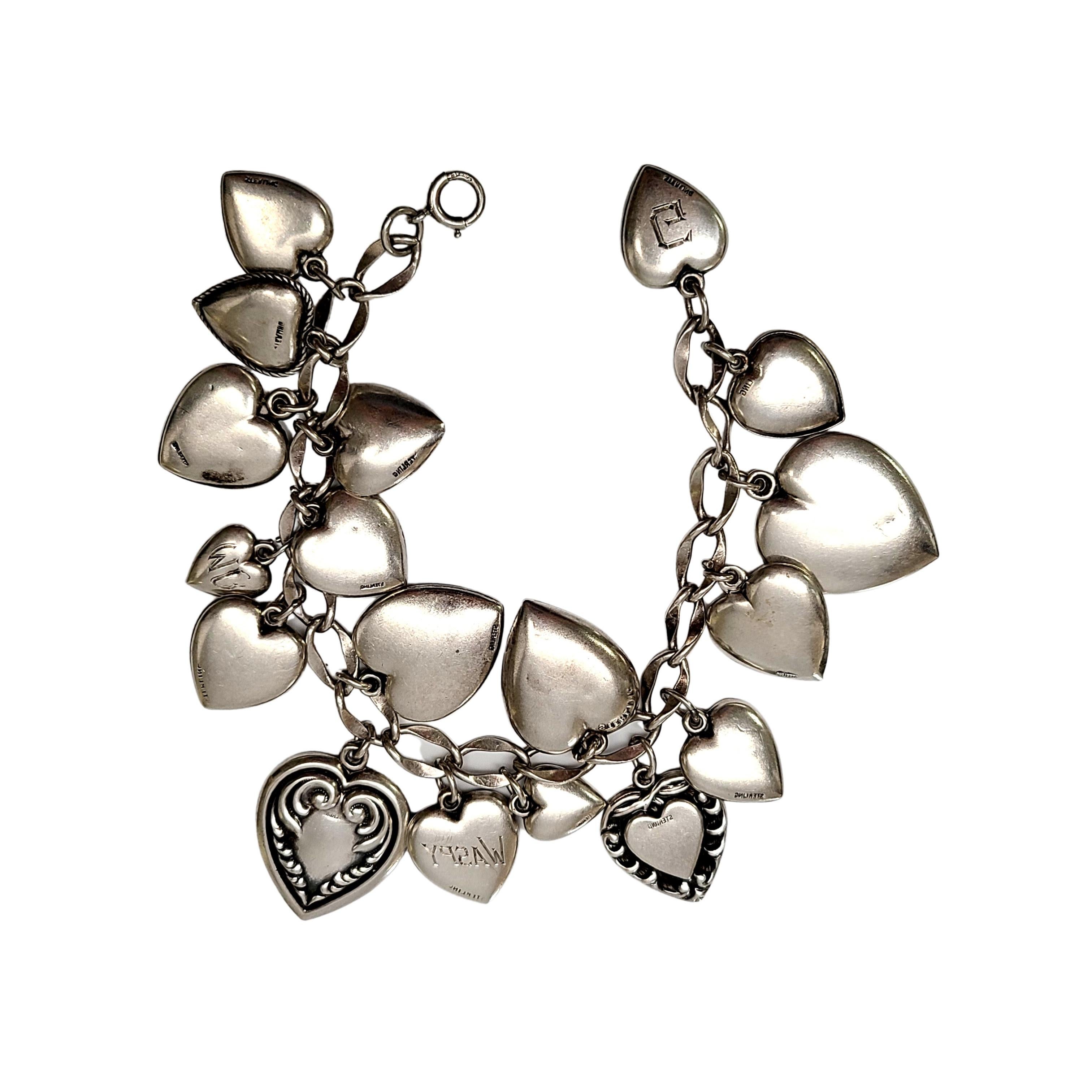 Sterling silver loaded puffy heart charm bracelet.

18 different heart charms adorn this loaded charm bracelet. Each heart have different designs, including 2 blue enameled hearts.

Measures 6 3/6