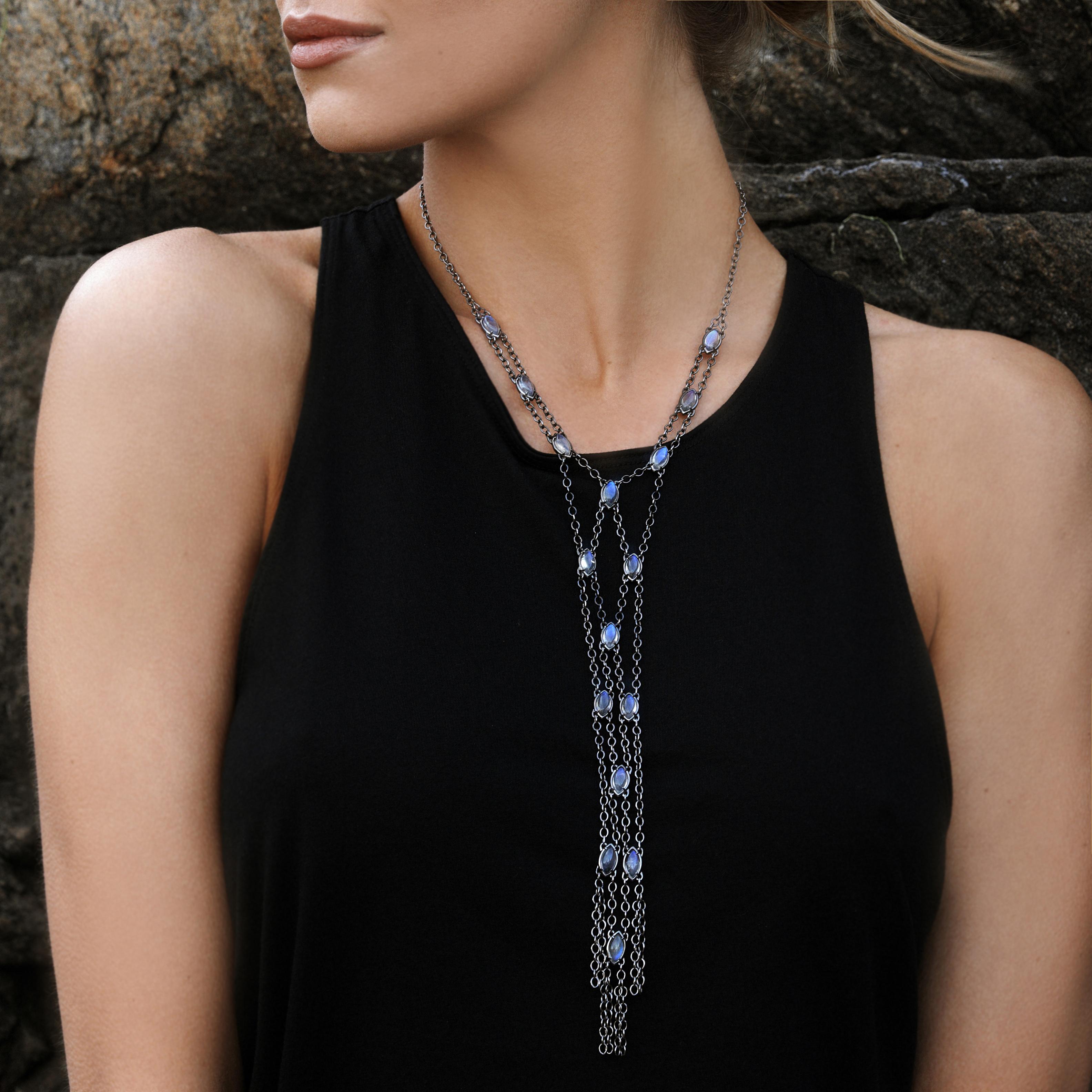 This sultry flowing Ribbon necklace consists of 16 luminous labradorite marquise cabochons set into draping mesh sterling silver chain. 
The versatility of this piece is wide ranging, functioning as a low key element inside a collared shirt or as a