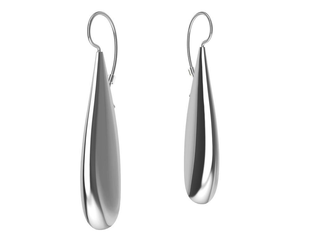 Longues boucles d'oreilles en argent sterling en forme de goutte d'eau, simplicité dans un monde complexe.  La conception pour Tiffany & Co. m'a aidé à élargir le design jusqu'à l'essence d'une forme. Ces longues gouttes de larmes sont creuses et