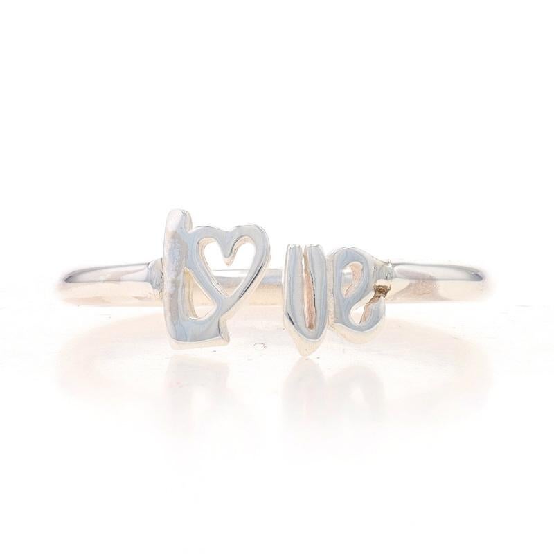 Size: 6

Metal Content: Sterling Silver

Style: Negative Space
Theme: Love, Heart
Features: Hollow Band Construction

Measurements
Face Height (north to south): 9/32