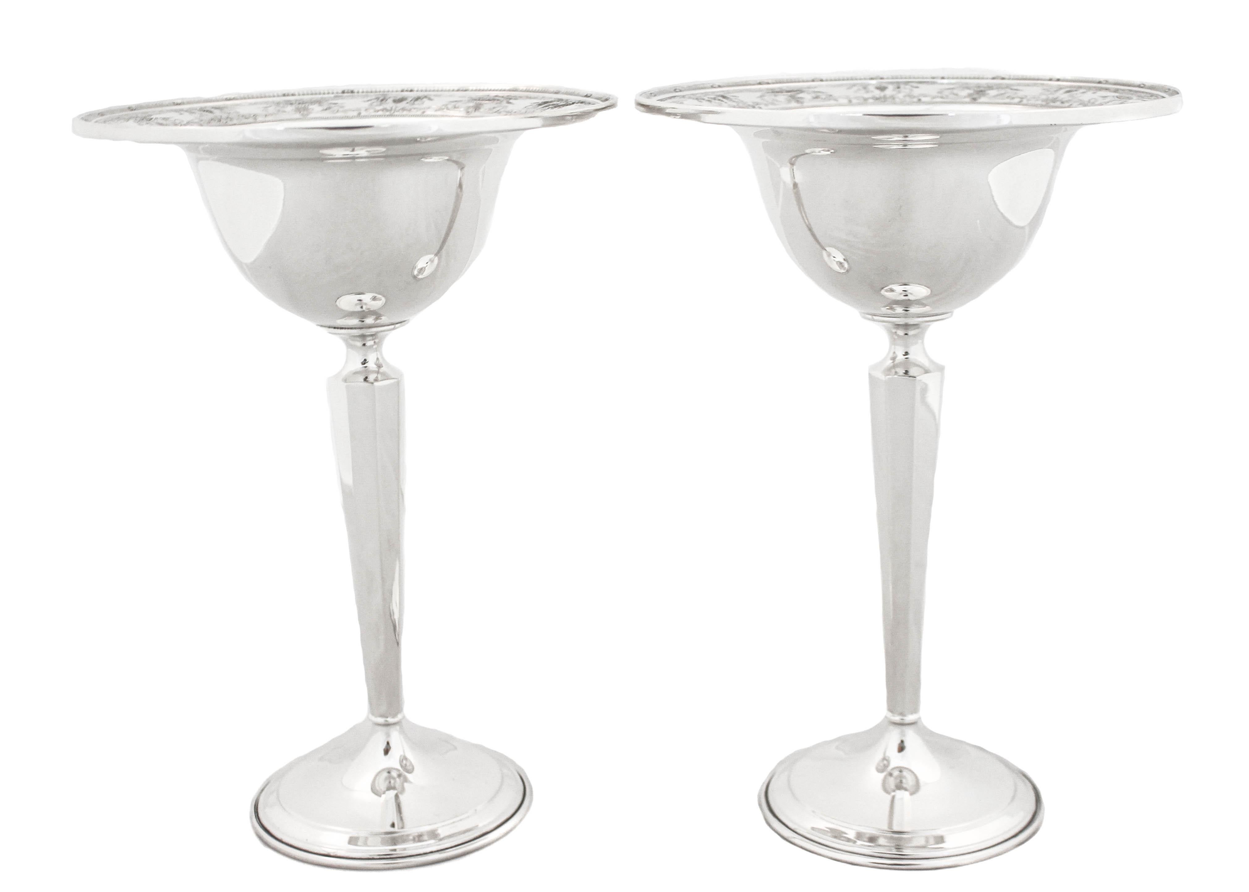 Proudly offering this pair of sterling silver compotes by International Silver in the “Maintenon” pattern from 1933.  They are exceptionally tall and the compote portion is deep thereby able to hold a substantial amount.  Around the edge there's a