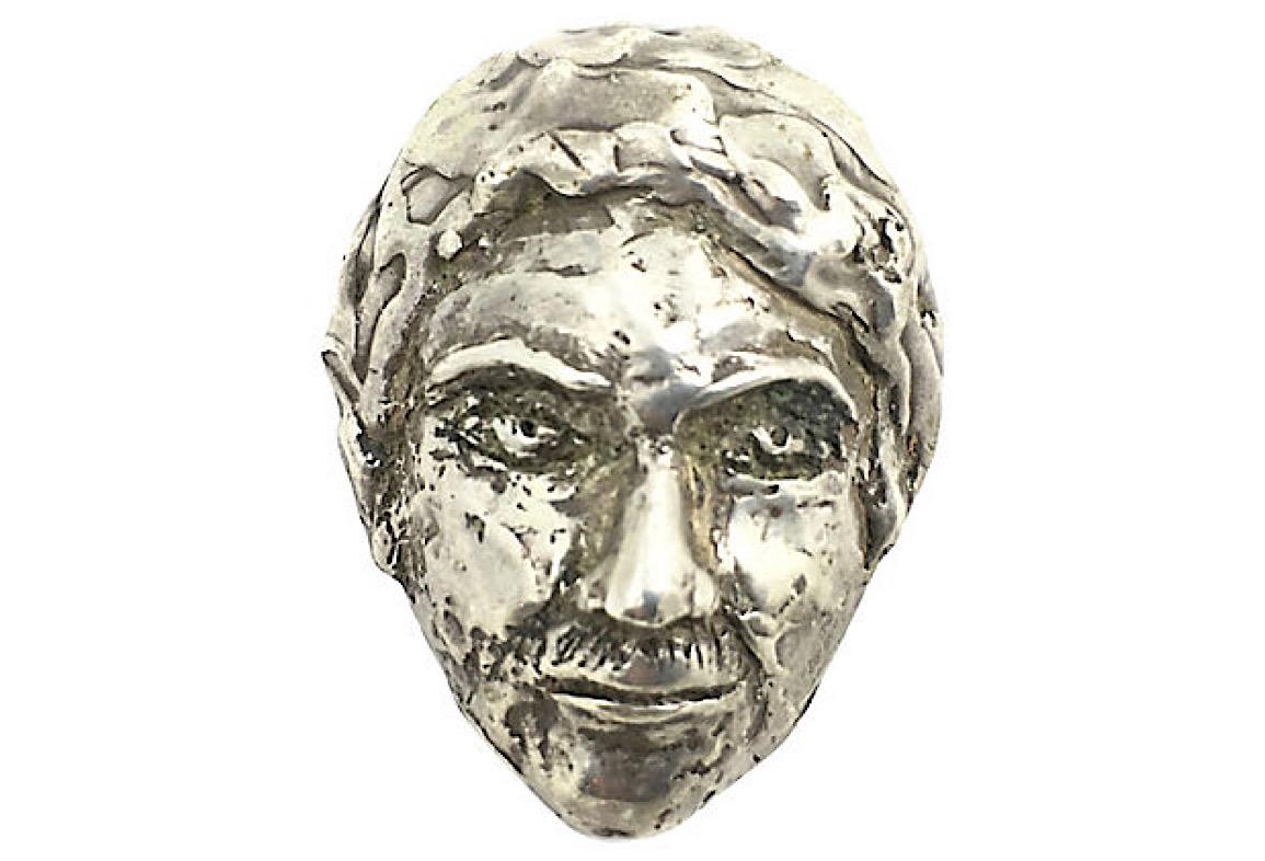 Handmade three-dimensional pendant in the form of a man's face. Box-link sterling silver chain included. Chain is marked 