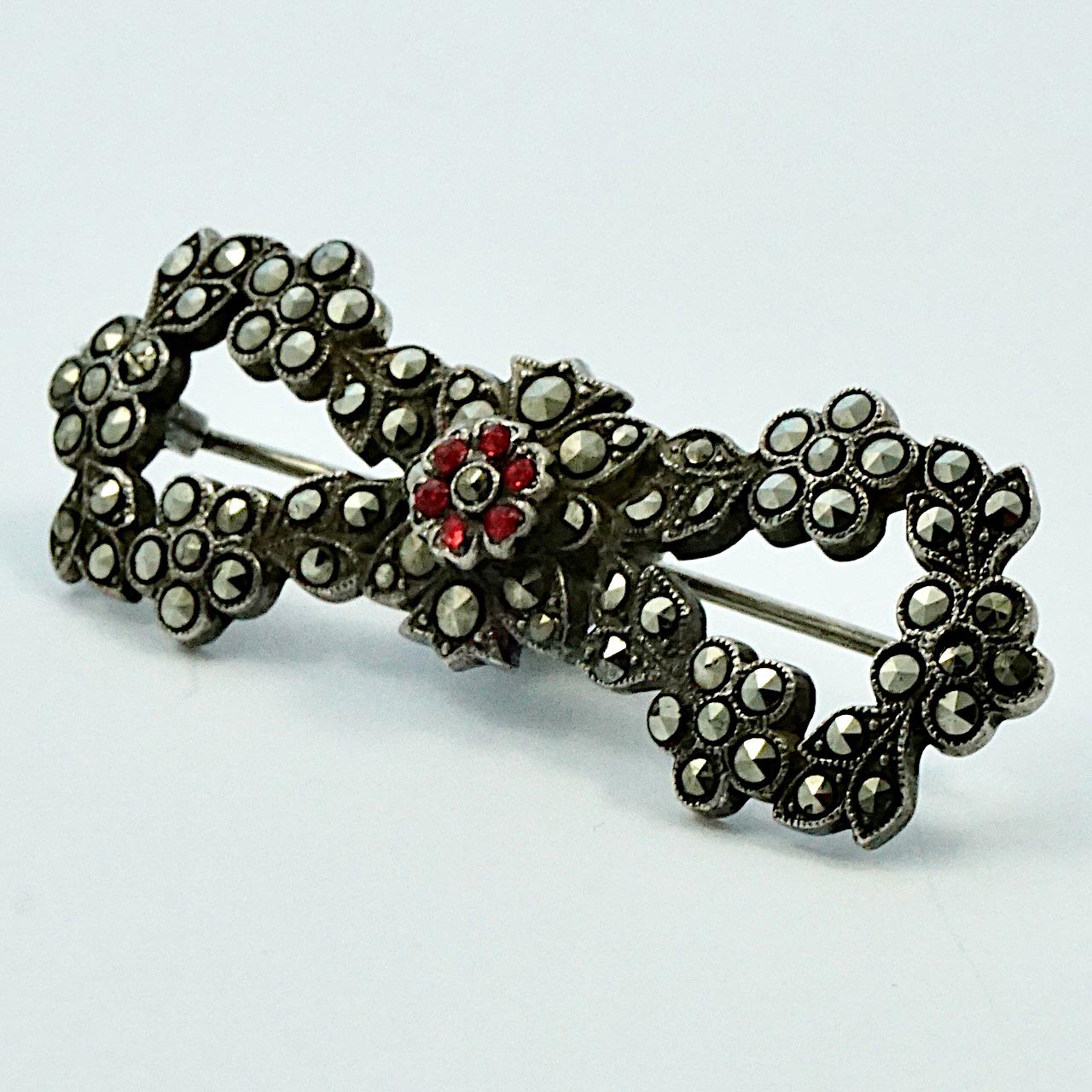 Round Cut Sterling Silver Marcasite Red Paste Stone Flower and Leaf Bow Brooch circa 1930s For Sale