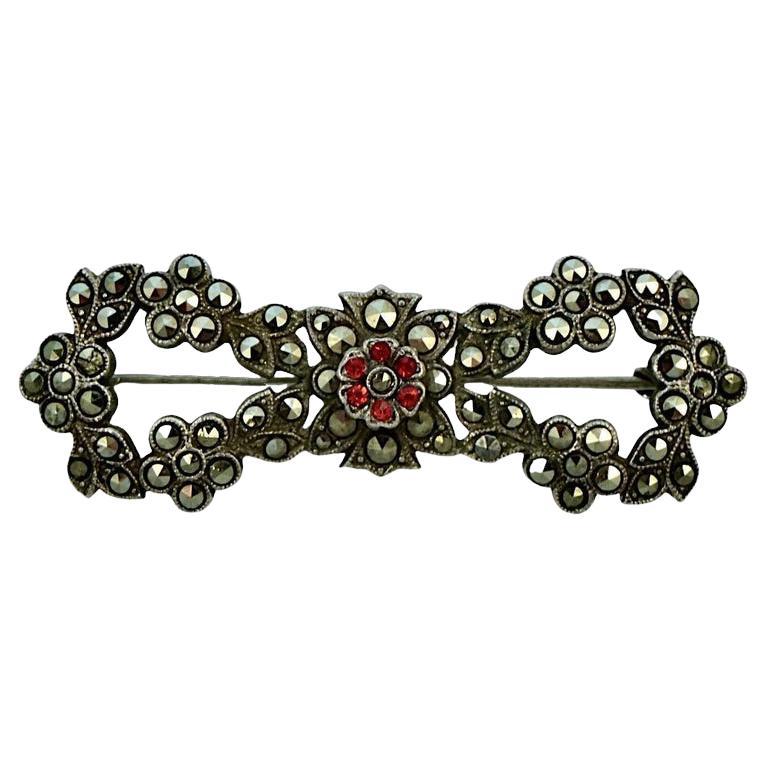 Sterling Silver Marcasite Red Paste Stone Flower and Leaf Bow Brooch circa 1930s For Sale
