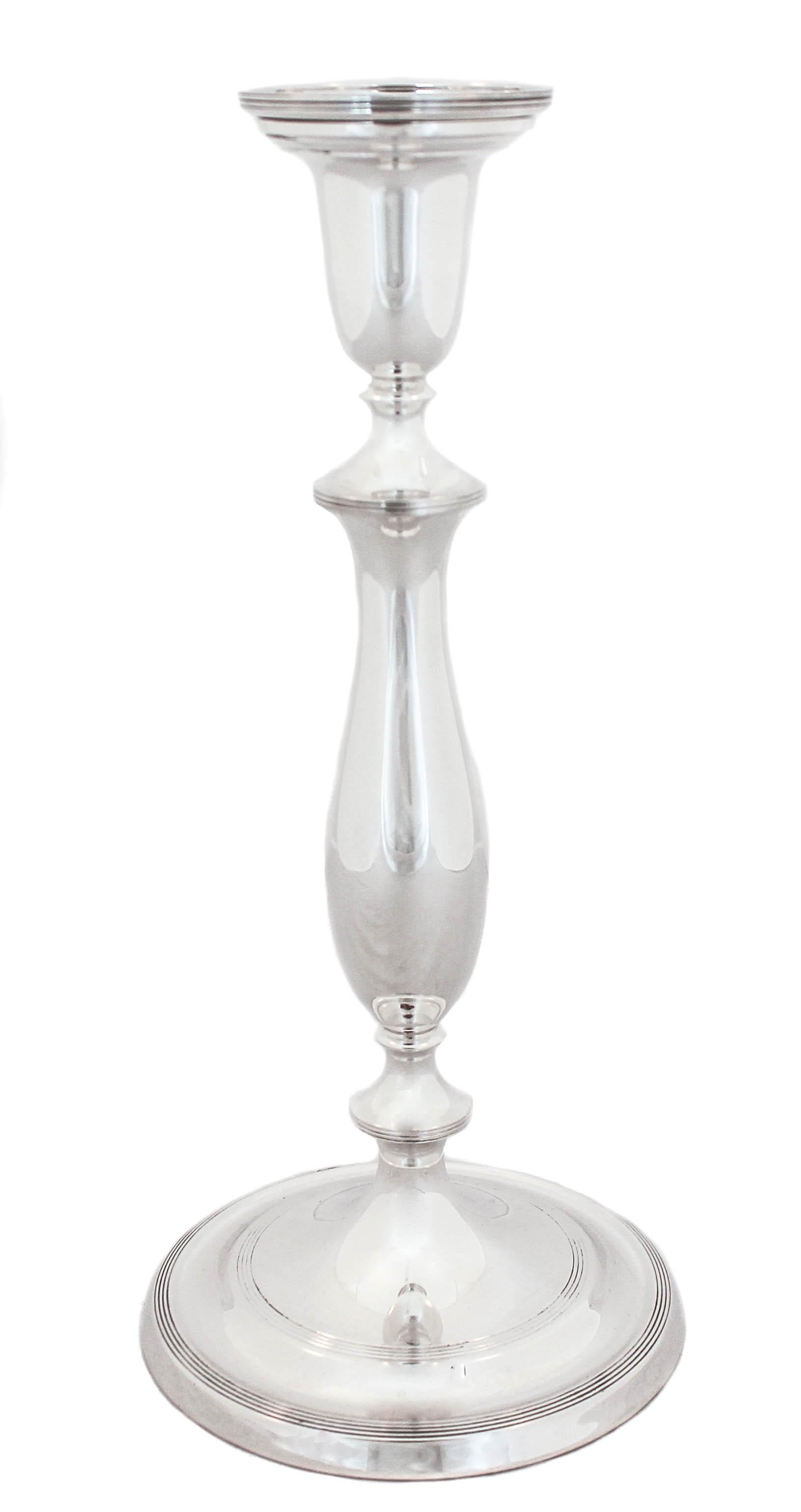 Being offered is a lovely pair of sterling silver candlesticks by Towle Silversmiths in the “Marie Louise” pattern of 1939.  A classic, timeless design gives these understated candleholders a distinguished and sophisticated air.  They are as