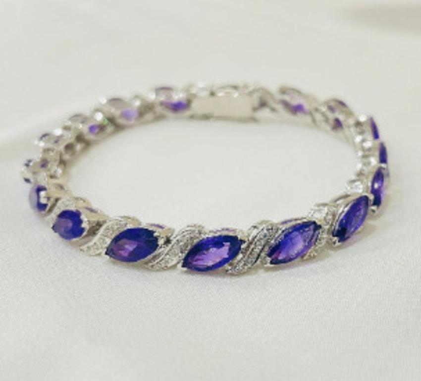 Beautifully handcrafted Amethyst Tennis Bracelets, designed with love, including handpicked luxury gemstones for each designer piece. Grab the spotlight with this exquisitely crafted piece. Inlaid with natural amethyst gemstones, this bracelet is