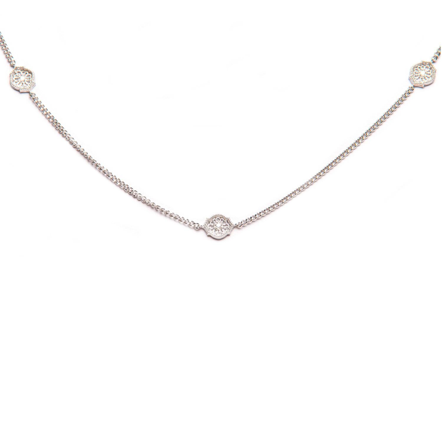 The ‘Mauresque’ Necklace by Natalie Barney features small Arabesque shape settings in a fine trace chain. It is a classical piece and comes with the matching stud earrings. Can be worn at both 42cm and 45cm.

Made in sterling silver. 

Inspired by a
