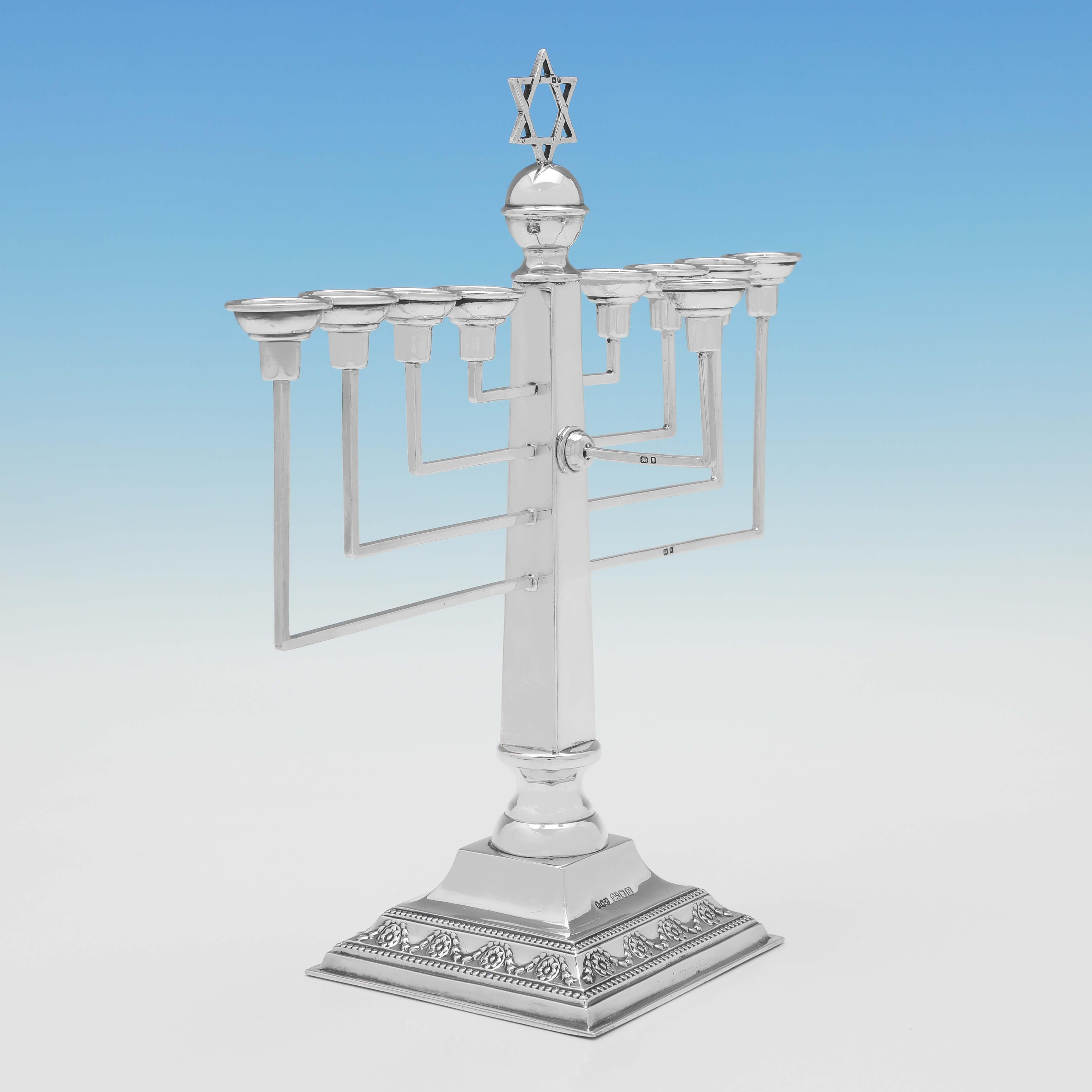 Hallmarked in London in 1948 by A. Taite & Sons, this Sterling Silver Menorah is traditional in design. The menorah measures 11