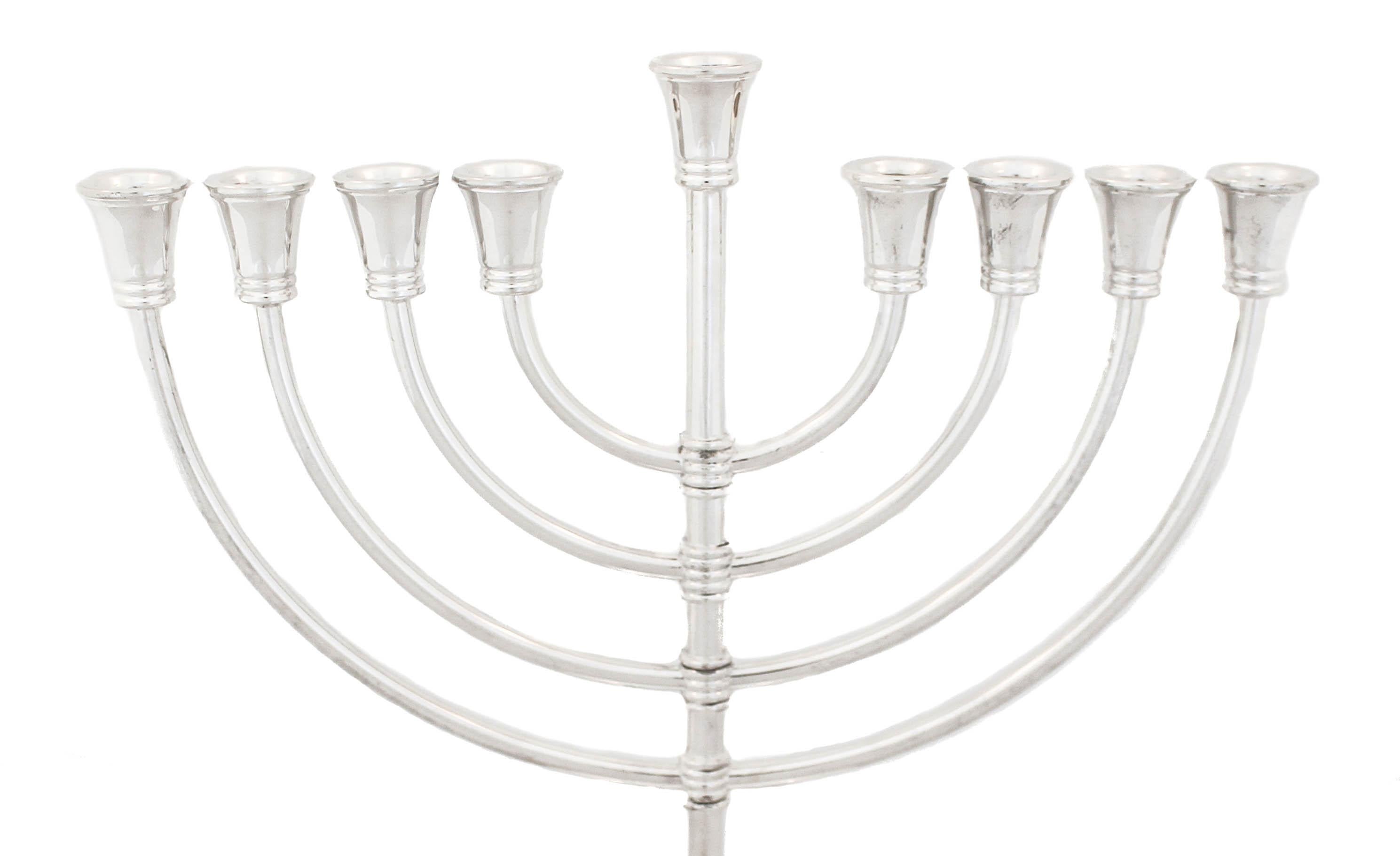 Being offered is a sterling silver menorah.  It has an understated elegance and the craftsmanship is beautiful.  Based on an old Tiffany & Company design, this menorah is the perfect size and look for any contemporary home setting.  The sleek round