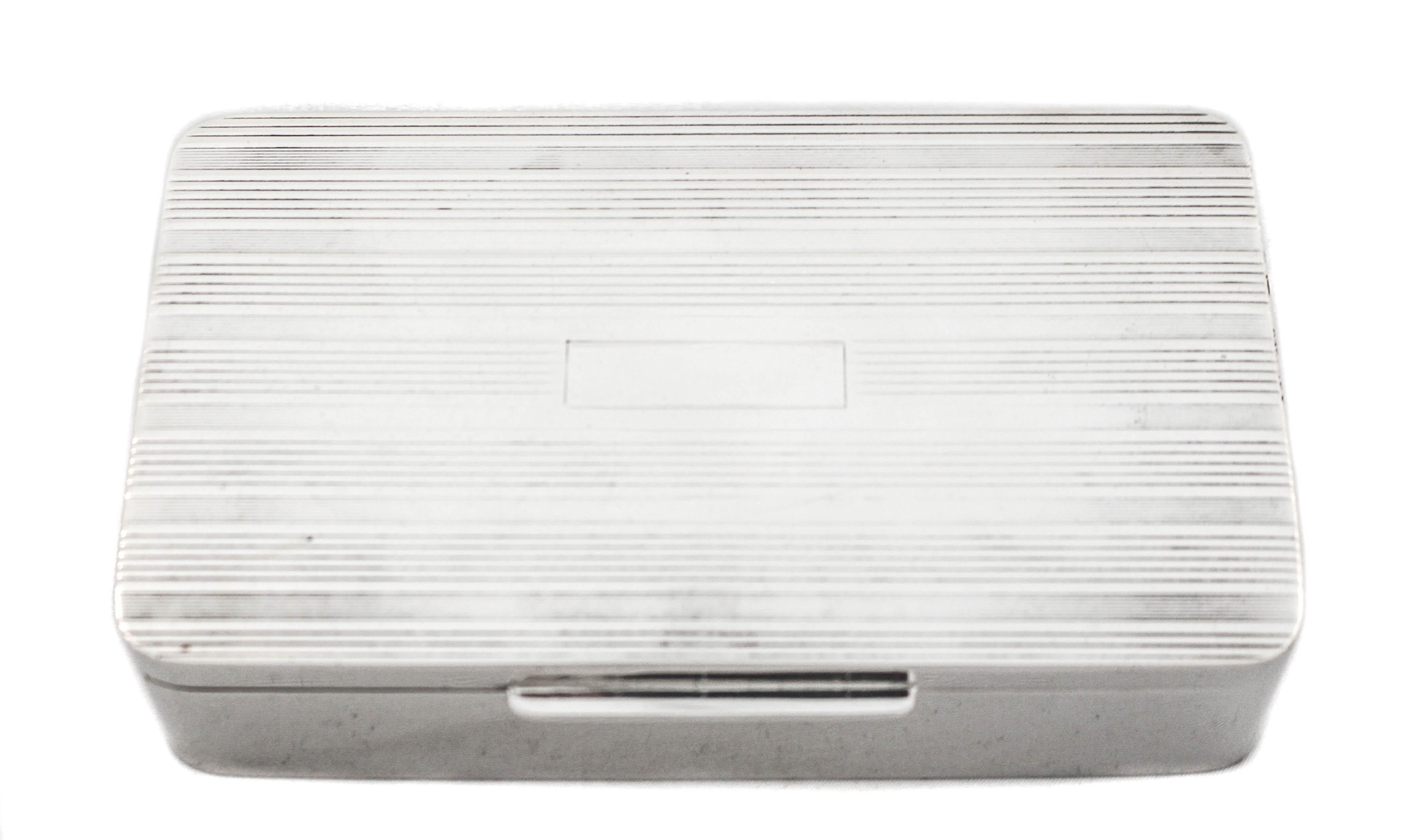 Being offered is a sterling silver mens jewelry box from the 1960’s.  It is sleek and masculine and the perfect size for cufflinks, watches and other accessories.  The lid has a pinstriped pattern and in the center a (rectangular)cartouche for a