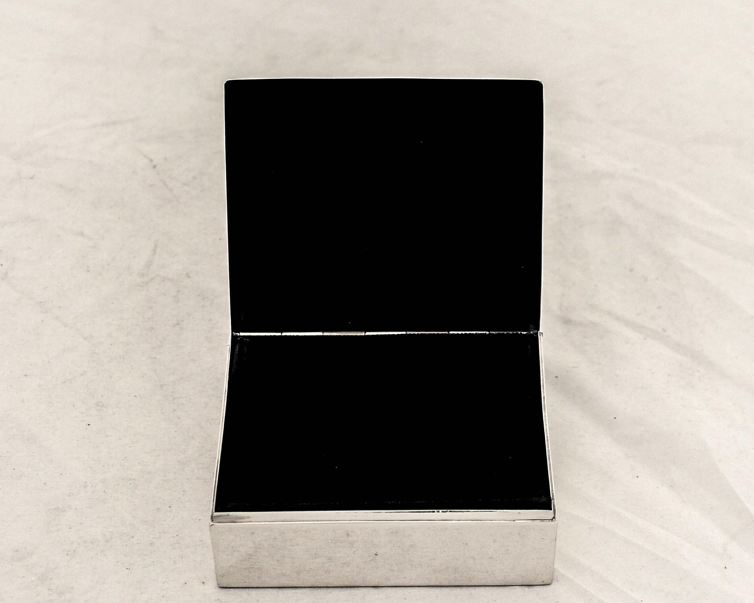 Being offered is a sterling silver men’s jewelry box by Smith & Smith of Attleboro, Massachusetts.  Smith & Smith specialized in cigar and jewelry boxes as well as other men’s novelty items.  The inside is lined in a rich navy velvet (NEW; we