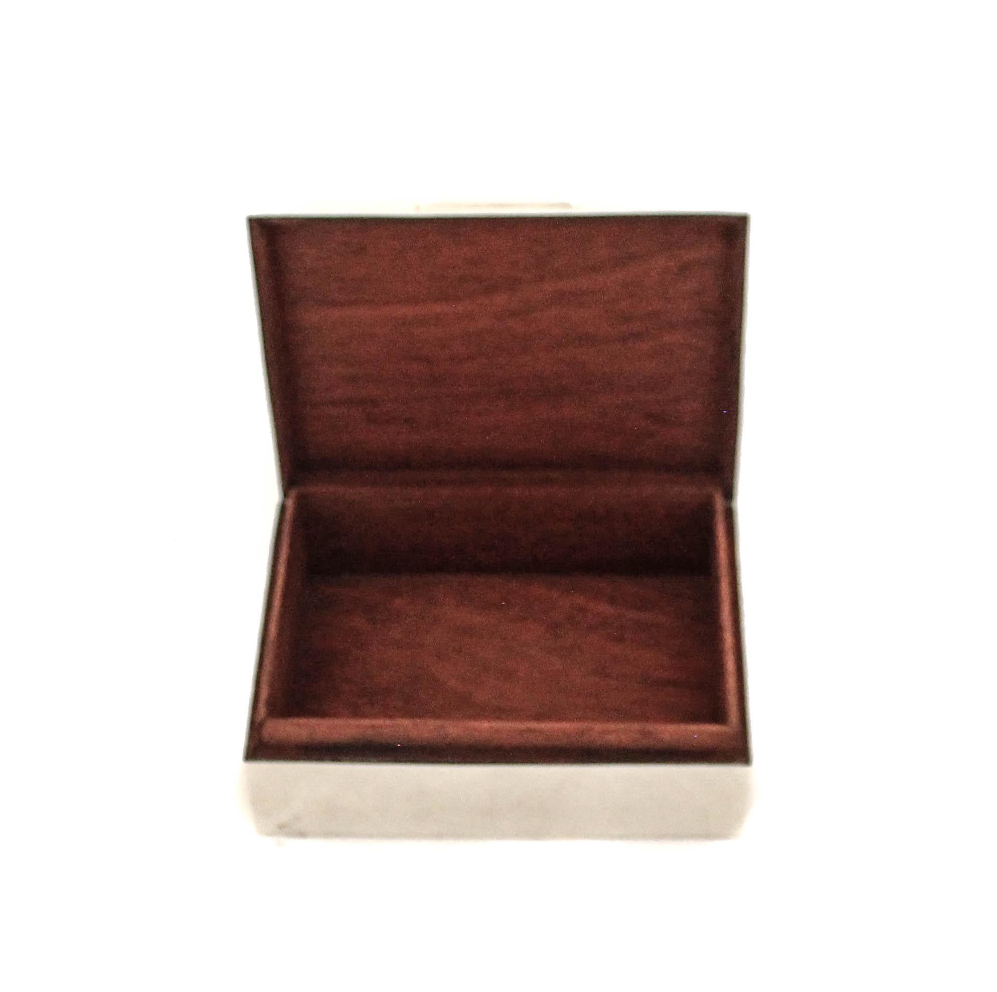 Being offered is a sterling silver men’s jewelry box made in England.  A sleek and handsome sterling exterior compliments the walnut brown wood finish on the interior.  A nice size for a ring, watch and cufflinks.  The perfect gift for the man who