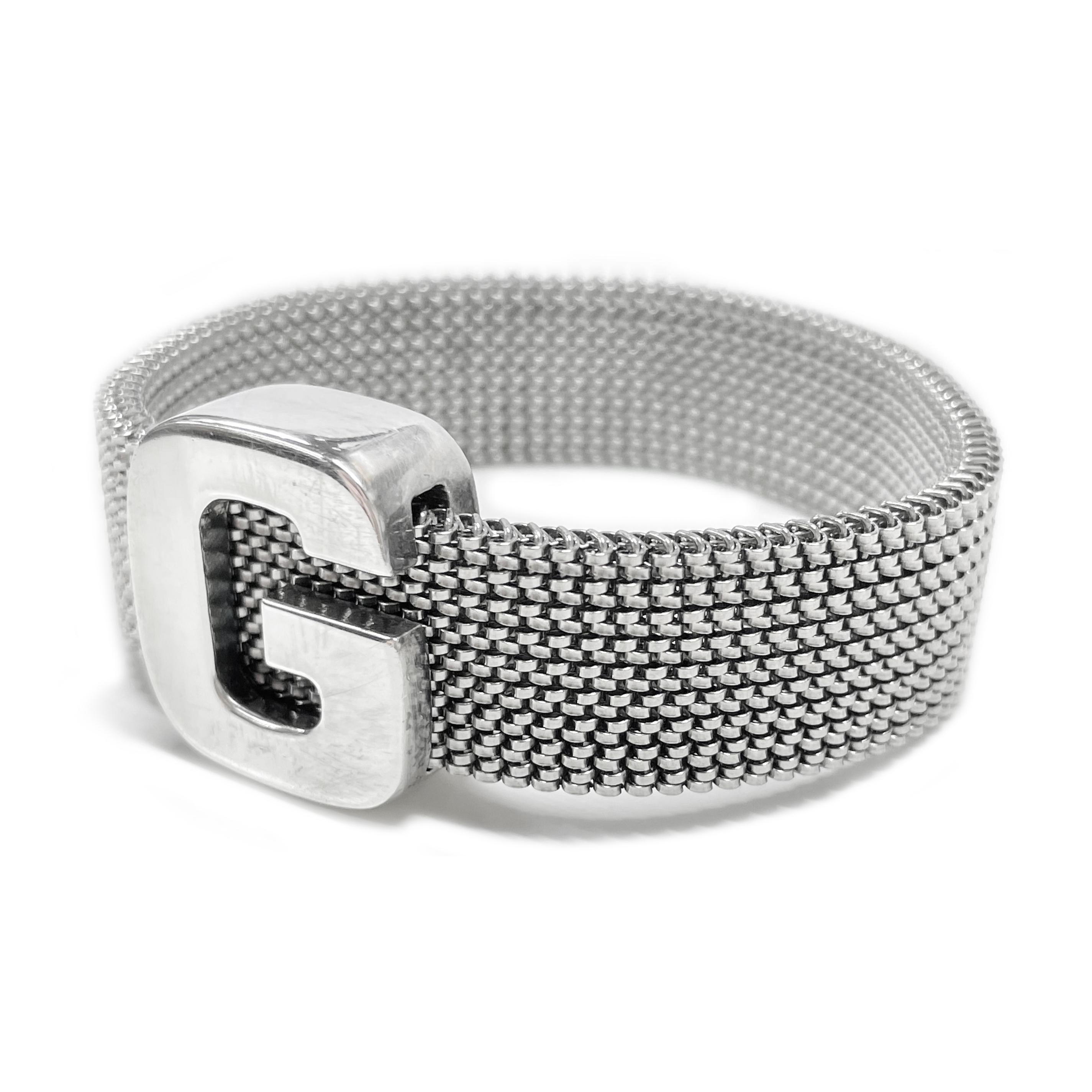 Sterling Silver G Mesh Bracelet. This 15.3mm wide expandable/stretchy bracelet effortlessly slips over the wrist and has a sliding G initial. The initial measures 23.5 x 20.85mm. Stamped on the bottom of the G is 925 Silver 1716 MI. The total weight