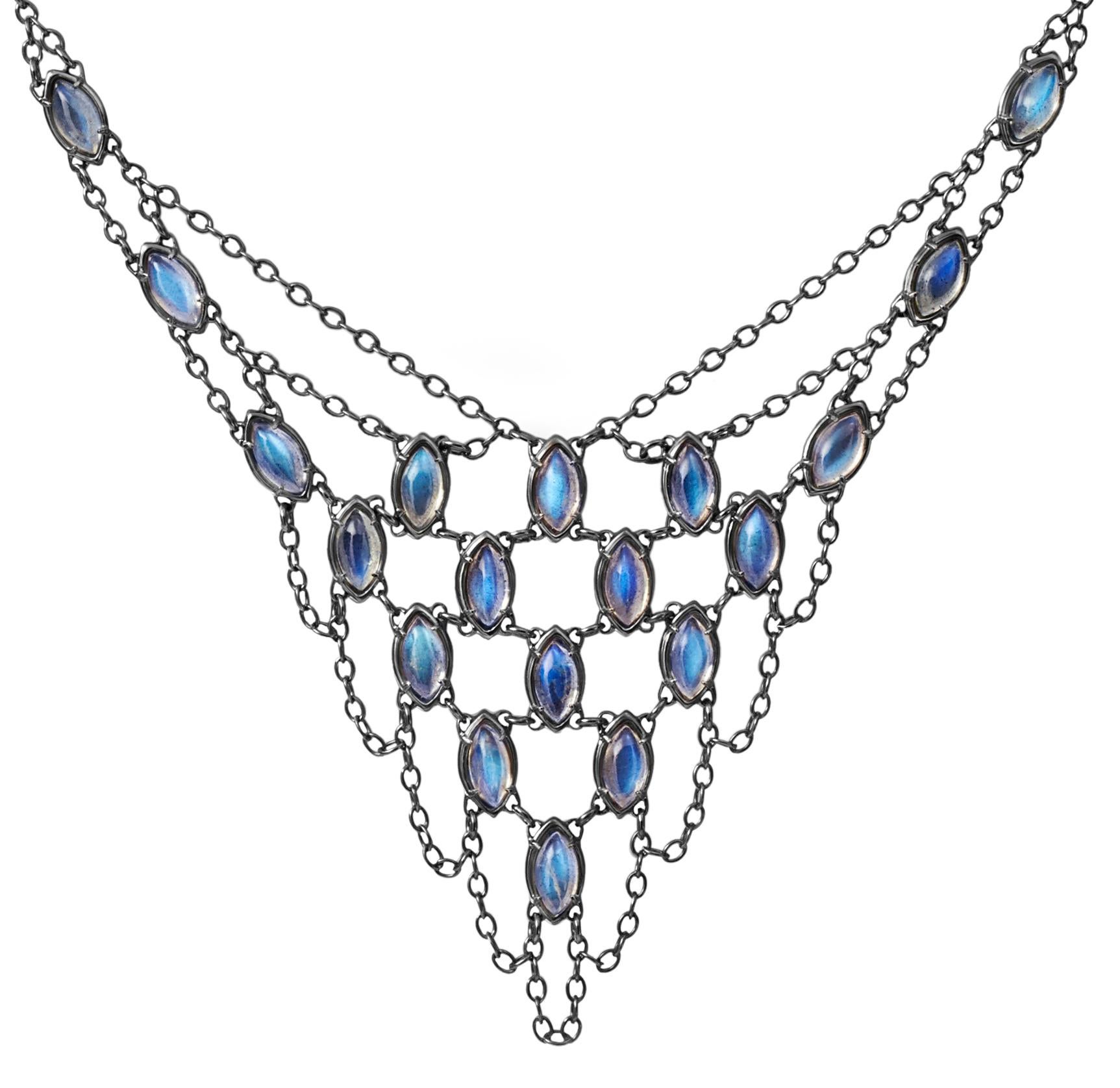 This sultry V shaped necklace consists of luminous labradorite marquise cabochons set into draping mesh chain. 
The feel of this sterling silver necklace is both elegant and sexy and can be positioned on the décolletage according to neckline of your