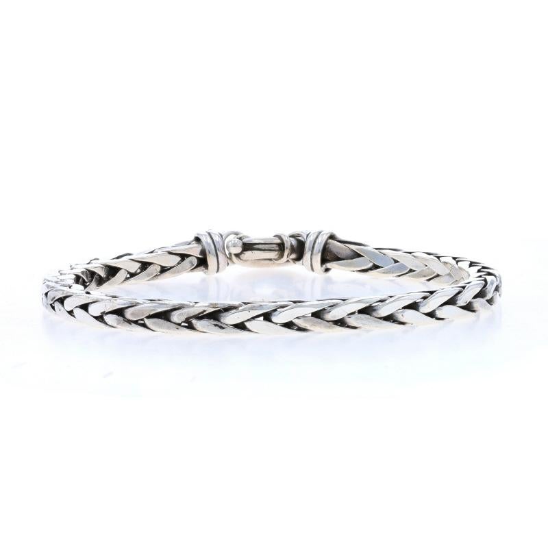Metal Content: Sterling Silver

Chain Style: Curb
Bracelet Style: Chain Charm
Fastening Type: Tab Box Clasp
Theme: Mexico, Latin America
Features: Etched Detailing

Measurements
Length: 6 1/4