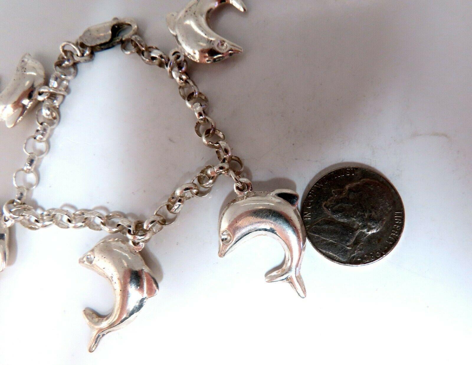 Sterling Silver Dolphins Charms Link Bracelet

7.5 Inch

5 Dolphins / 19 x 28mm

19.1 Grams