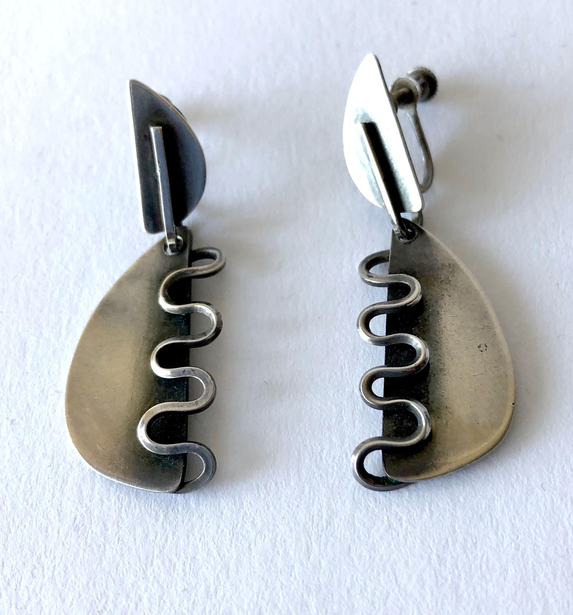 1950's American modernist squiggle earrings possibly created by Paul Lobel or Henry Steig. These earrings are unsigned by the maker.  Earrings measure 1 5/8