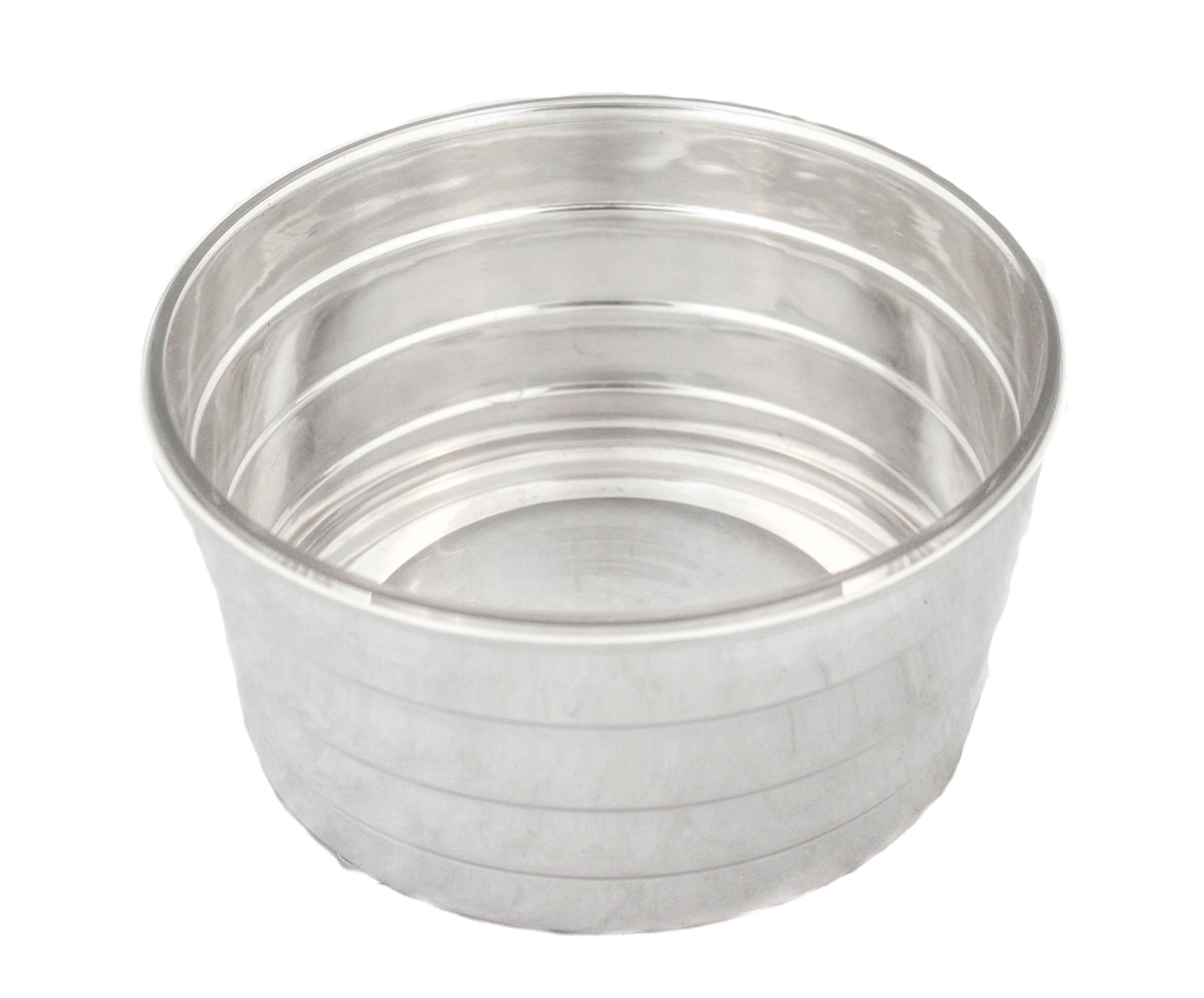 We are offering a sterling silver mid-century ice bucket by the Meriden Britannia Company of Meriden, Connecticut. The base has four feet propping it off the surface. The body is quintessential mid-century in its simplicity and form. The glass liner