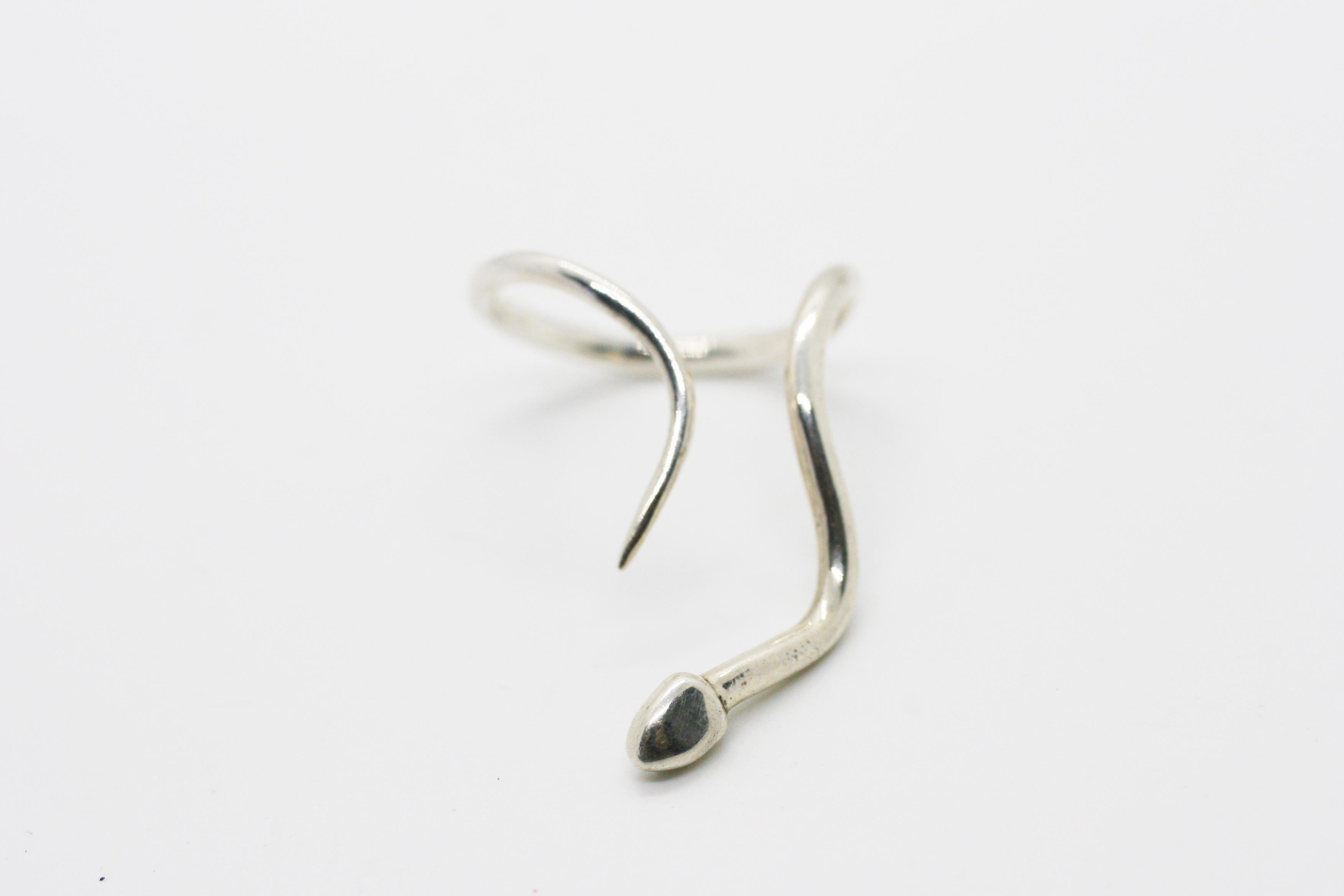 Mini Snake Ring features Perez Bitan's signature architectural curved snake set in Sterling Silver
Can be worn pointed up or down the finger 
Great piece for layering additional snake rings or bands 
